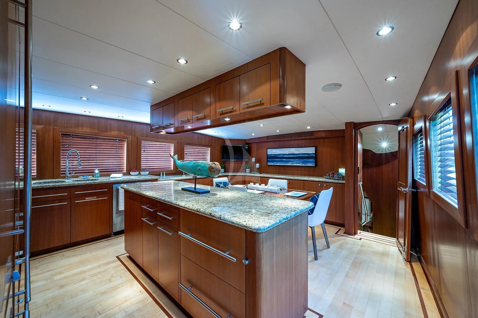 a kitchen with wooden cabinets aboard MAGNUM RIDE Yacht for Charter