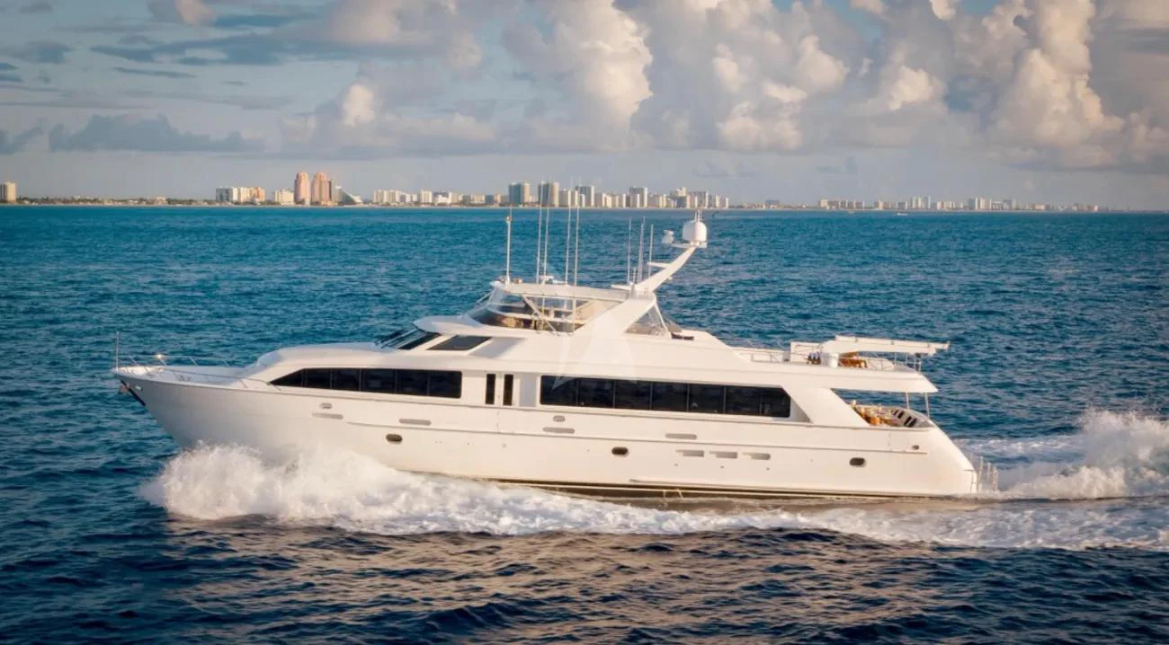 a white yacht on the beach aboard MAGNUM RIDE Yacht for Charter