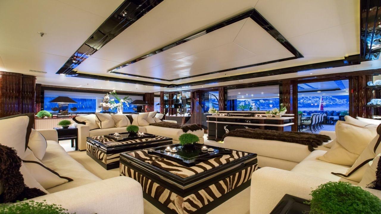 a living room with a large window aboard LIONESS V Yacht for Charter