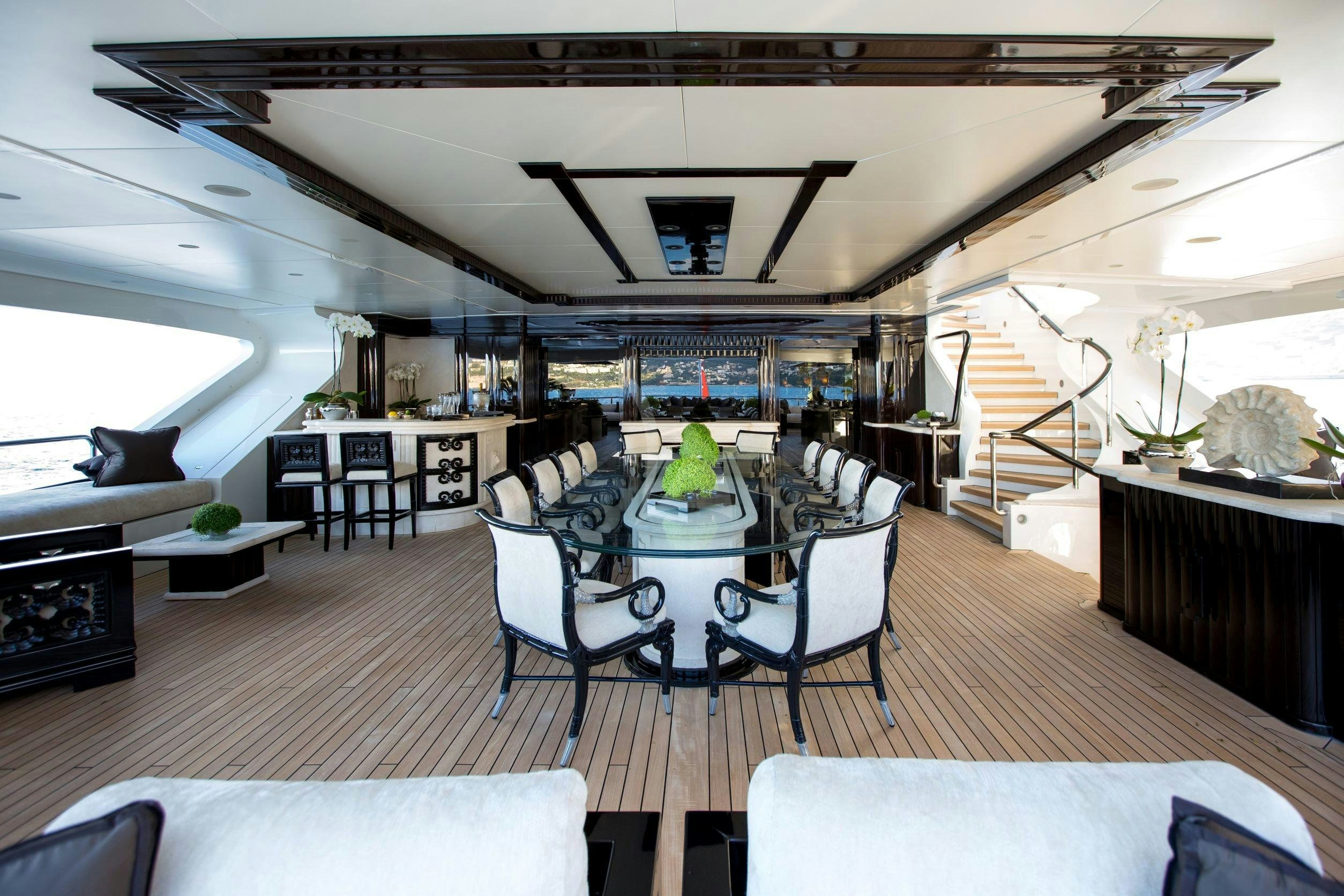 a room with a table and chairs aboard LIONESS V Yacht for Charter