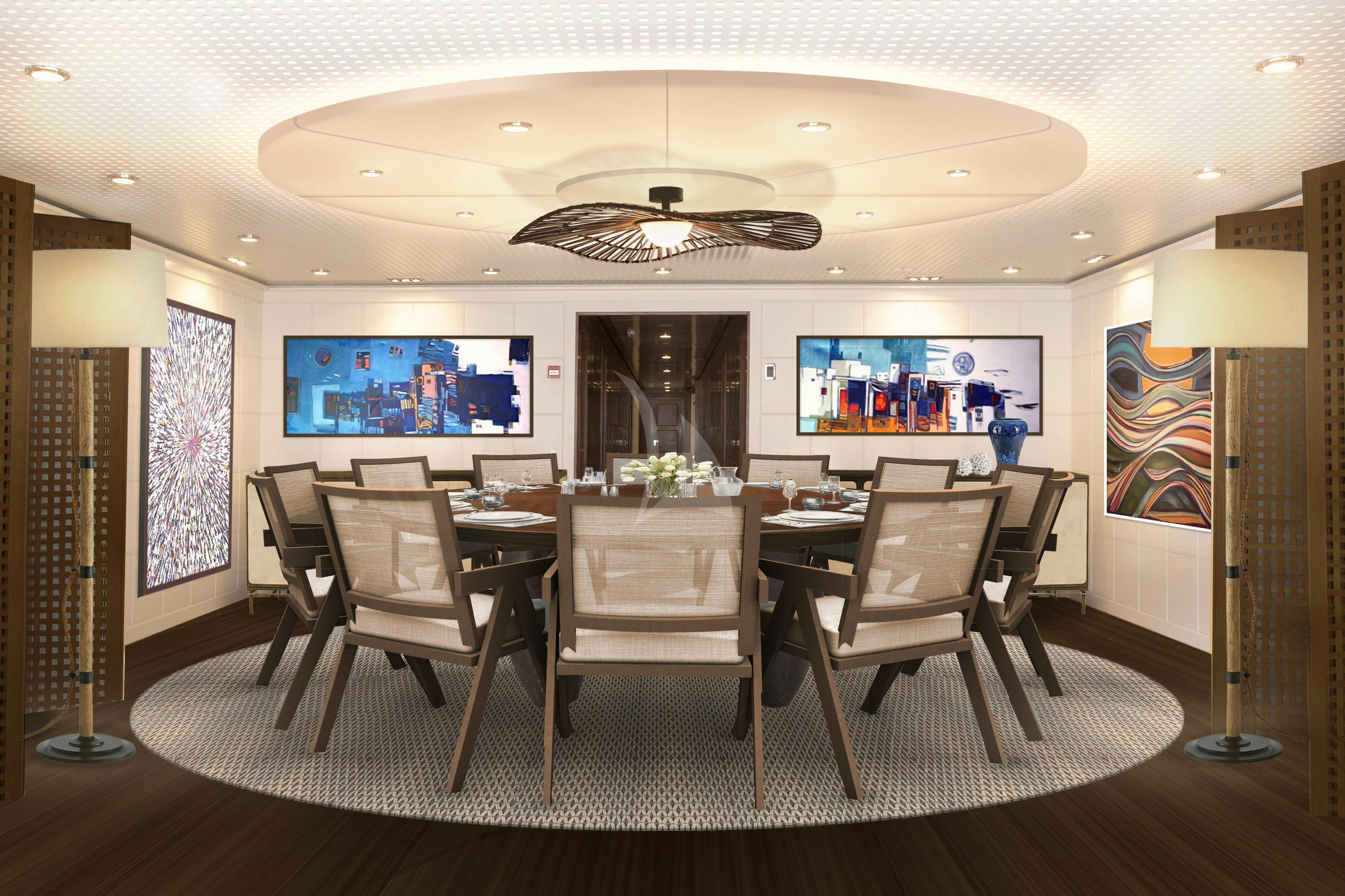 a room with a table and chairs aboard HBC Yacht for Charter