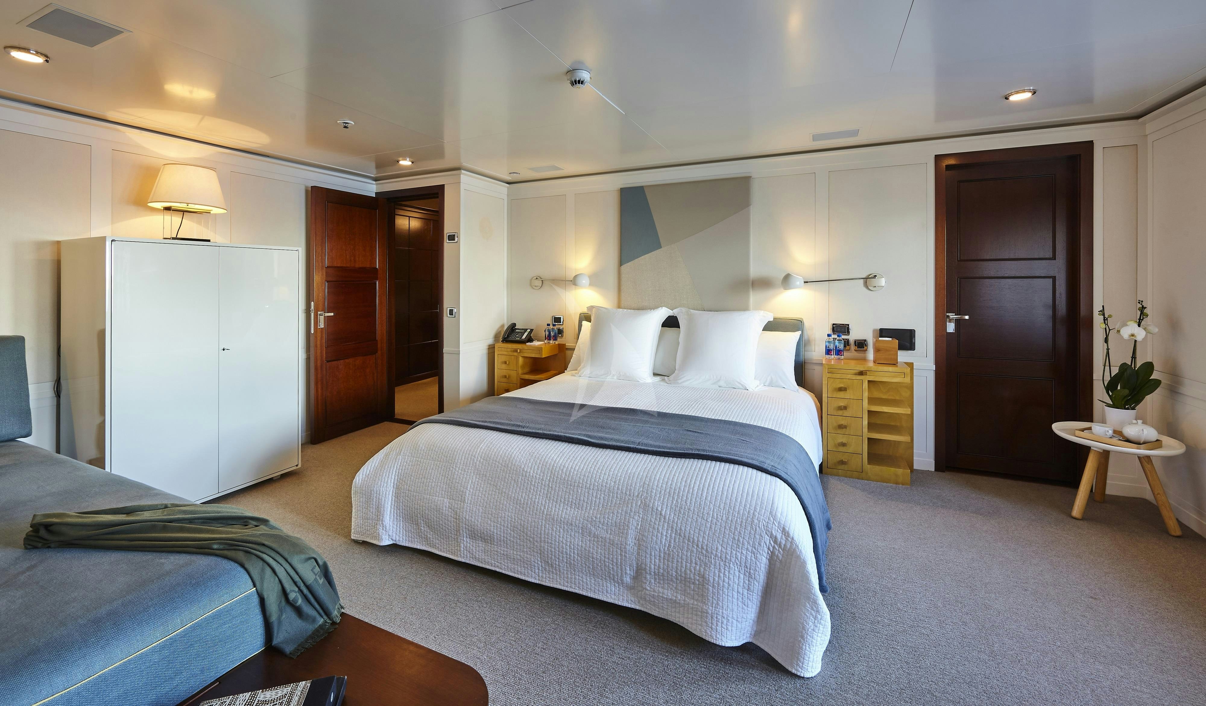 a bedroom with two beds aboard HBC Yacht for Charter