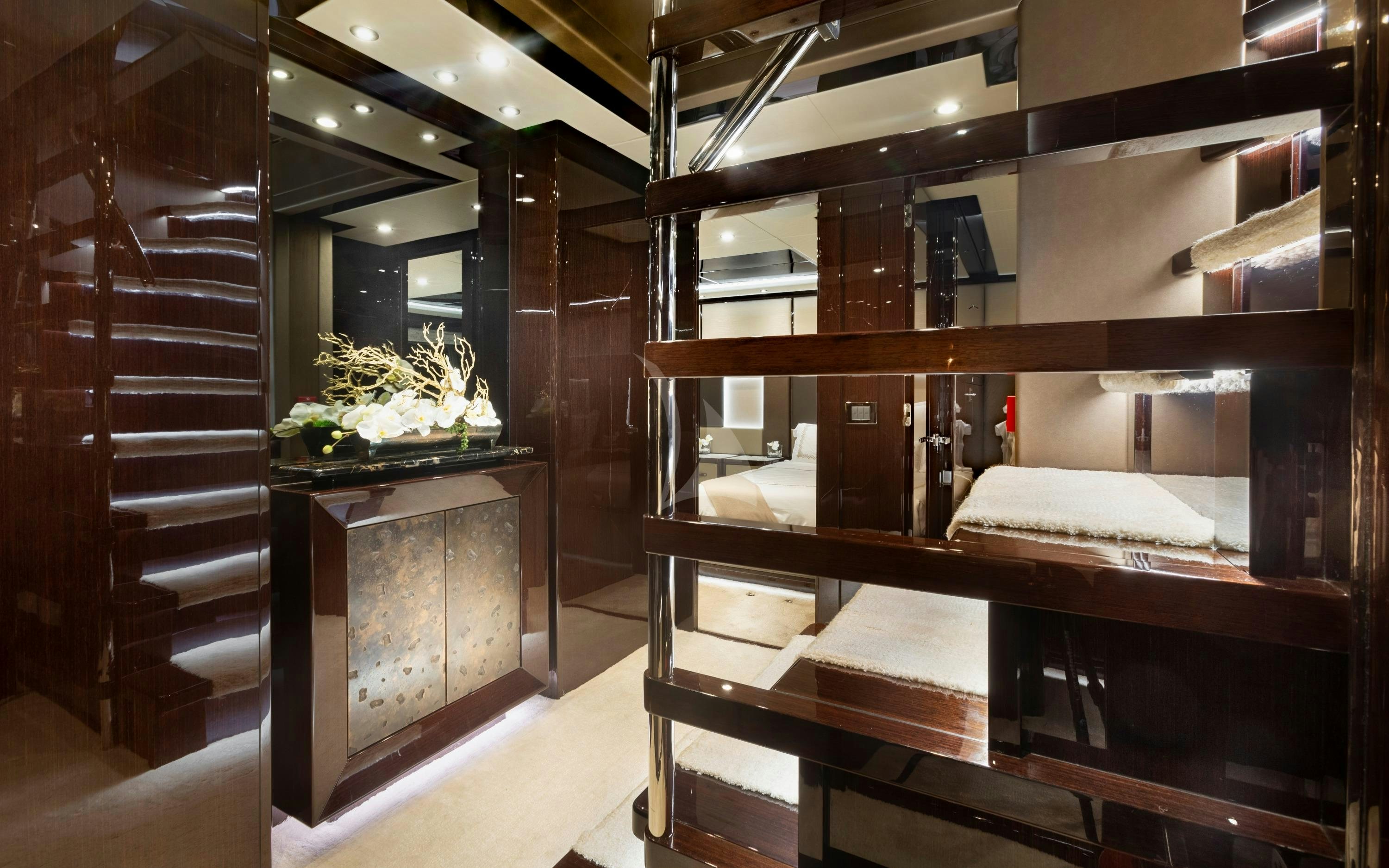 a room with wooden shelves aboard EXODUS Yacht for Charter