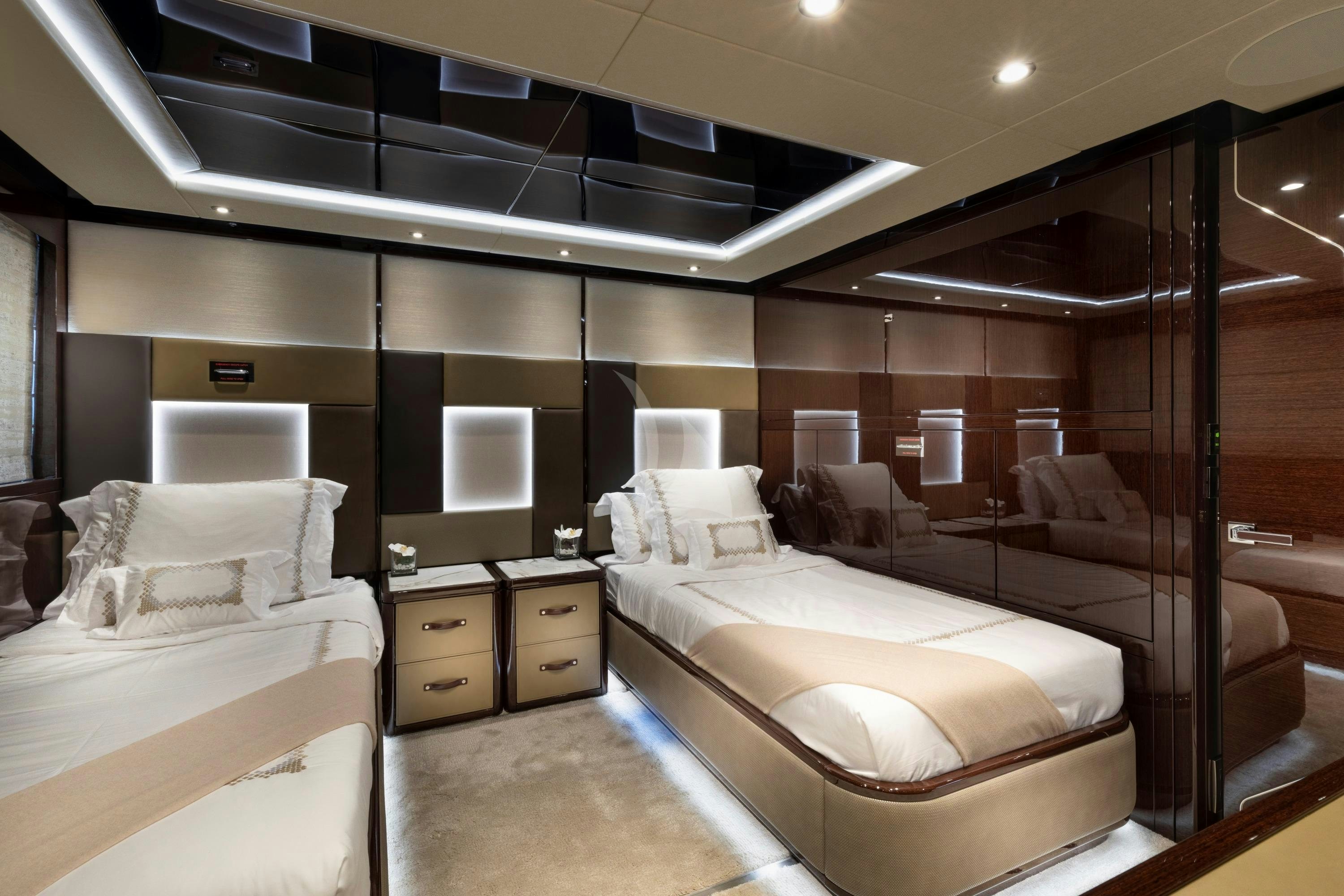 a room with a bed and a couch aboard EXODUS Yacht for Charter