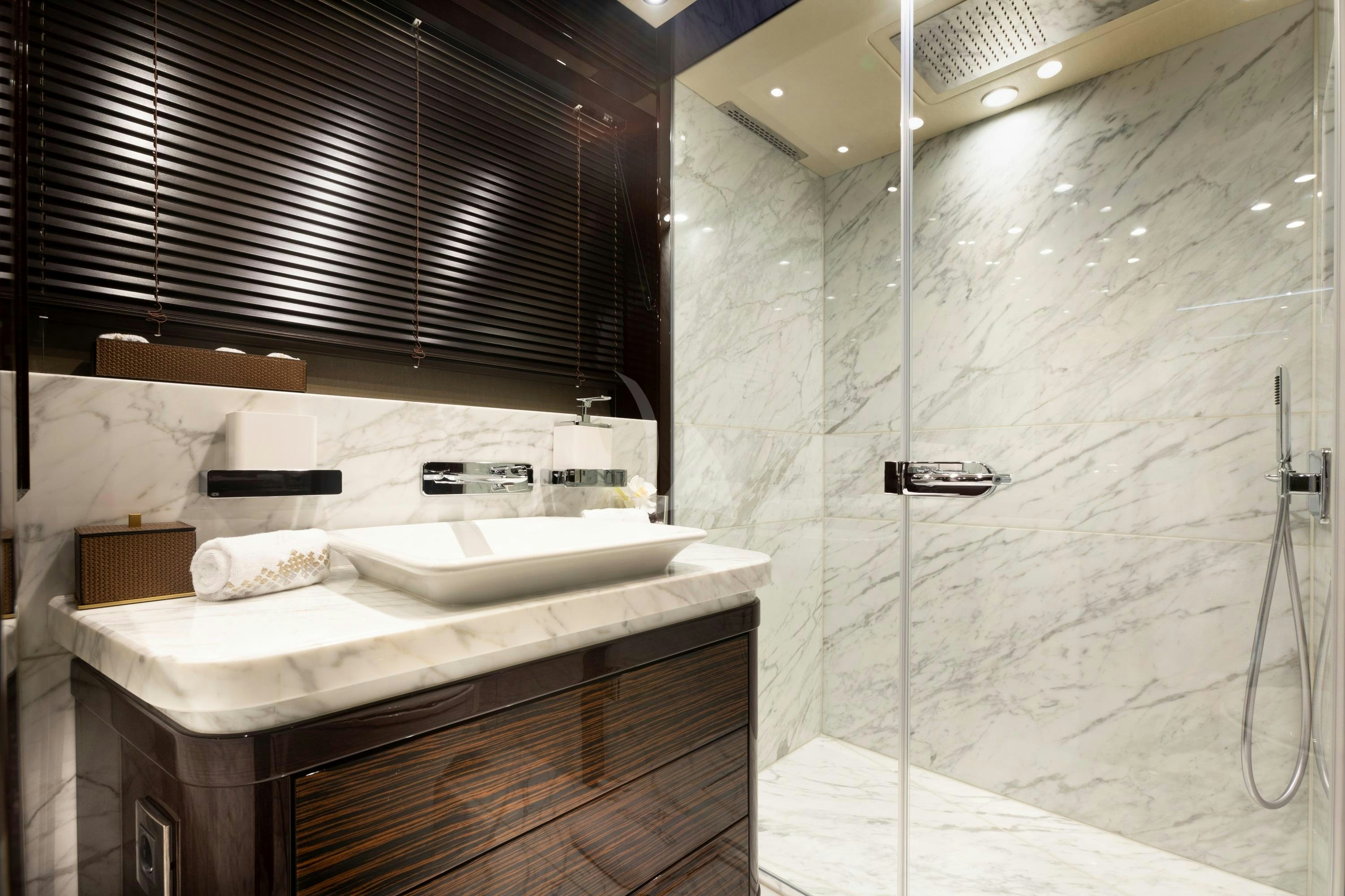 a bathroom with a sink and a shower aboard EXODUS Yacht for Charter