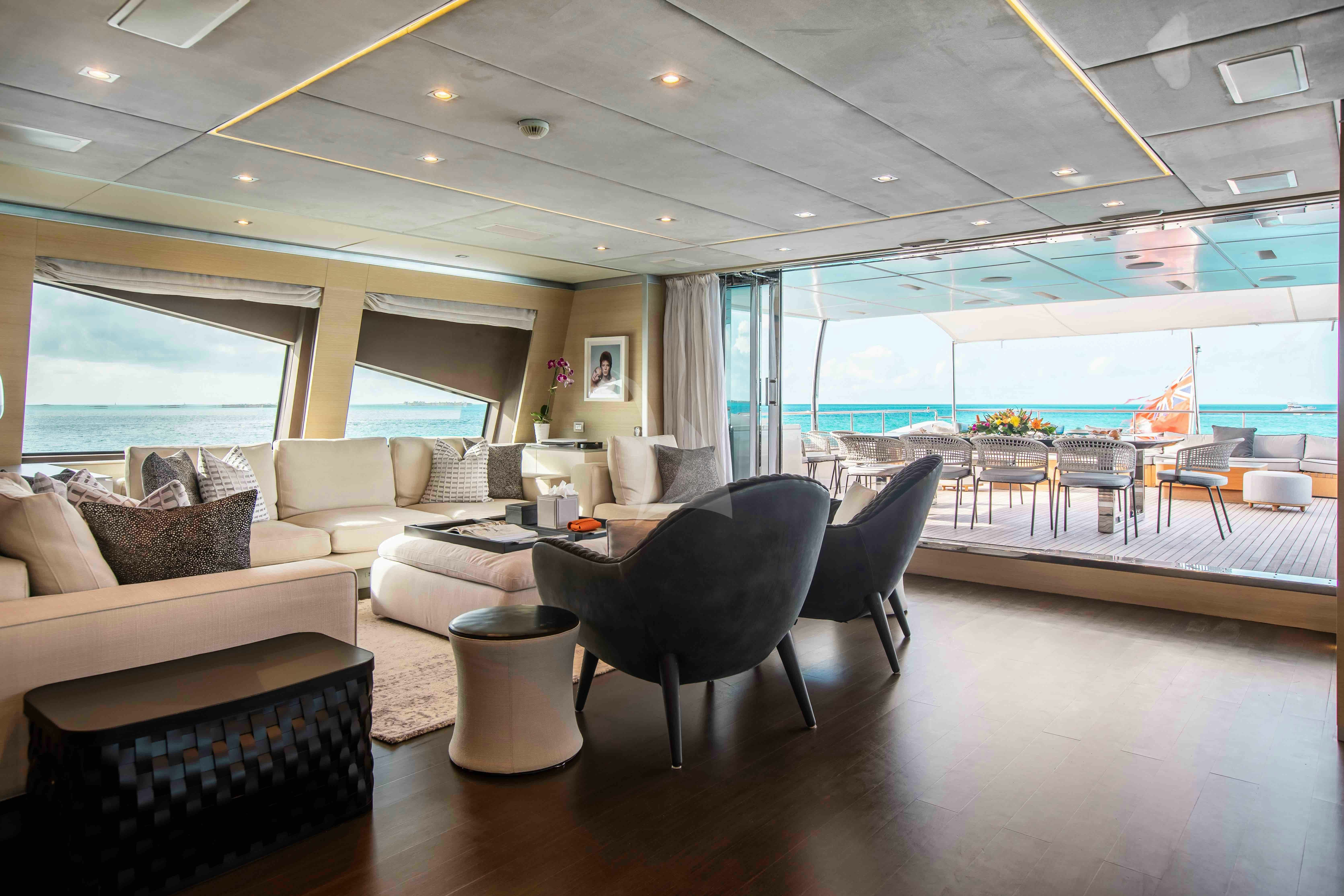 a room with a couch and a table and chairs aboard EMINA Yacht for Charter