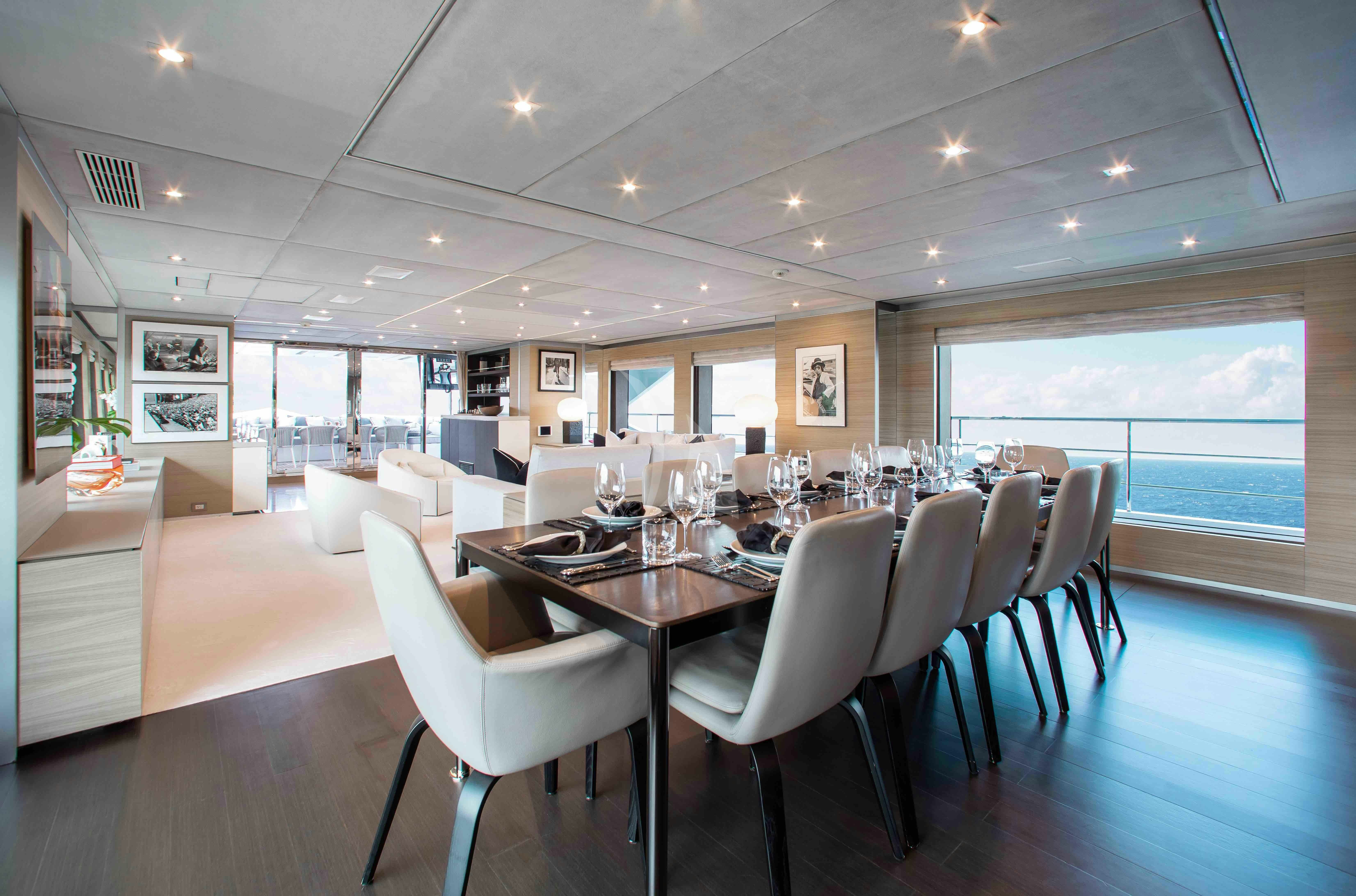 a large dining room with a large table and chairs aboard EMINA Yacht for Charter