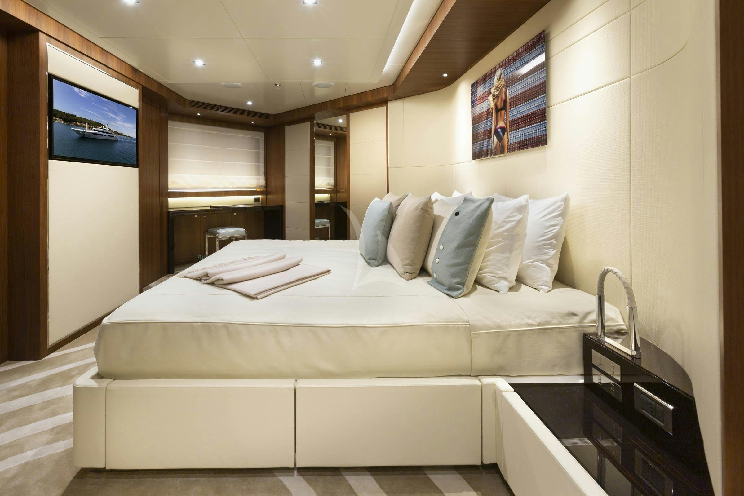 a bed in a room aboard TALEYA Yacht for Charter