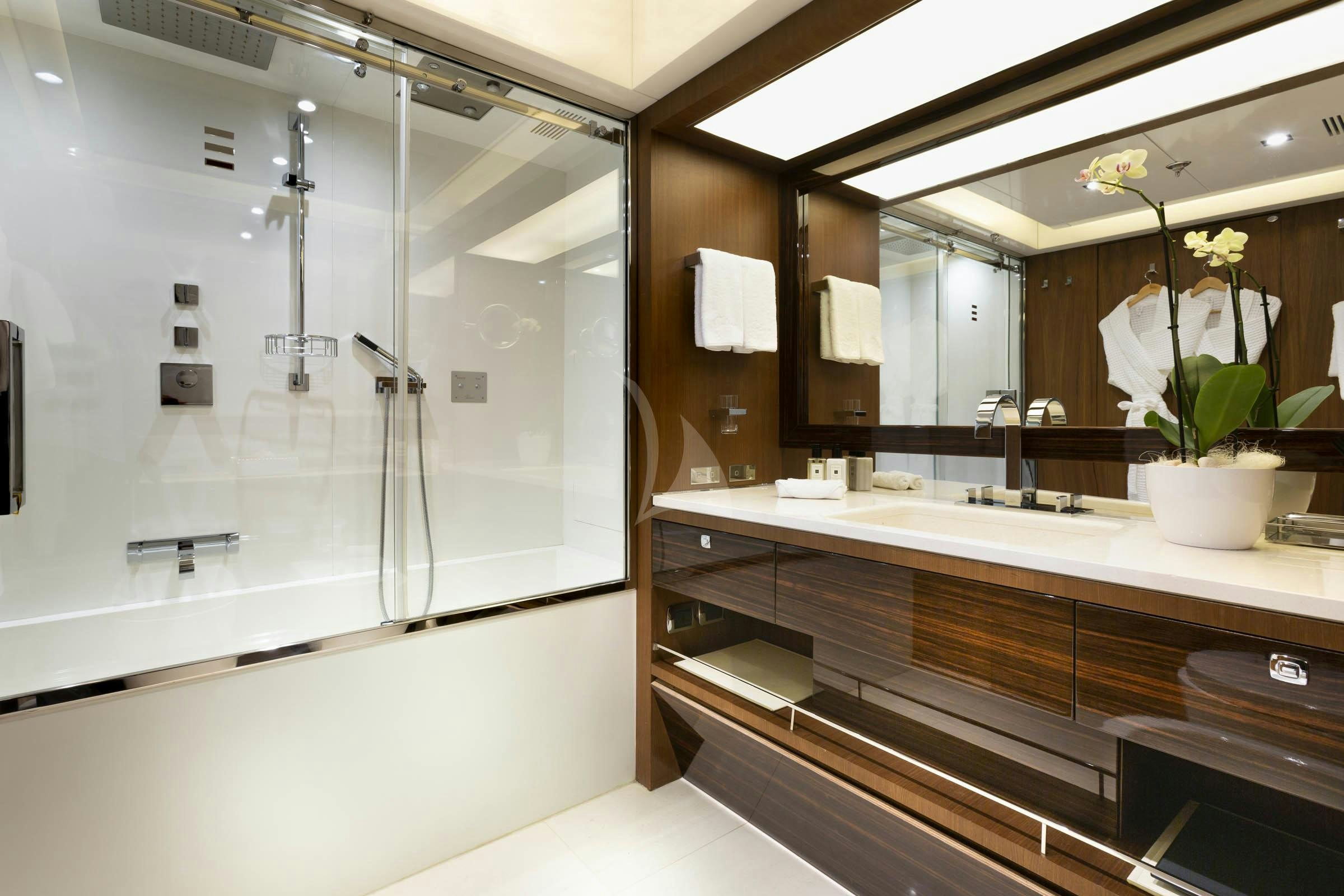 a bathroom with a large mirror aboard TALEYA Yacht for Charter