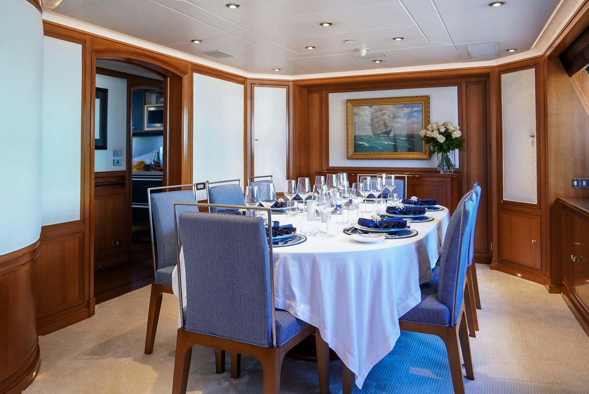 a dining room with a table aboard ZENJI Yacht for Charter