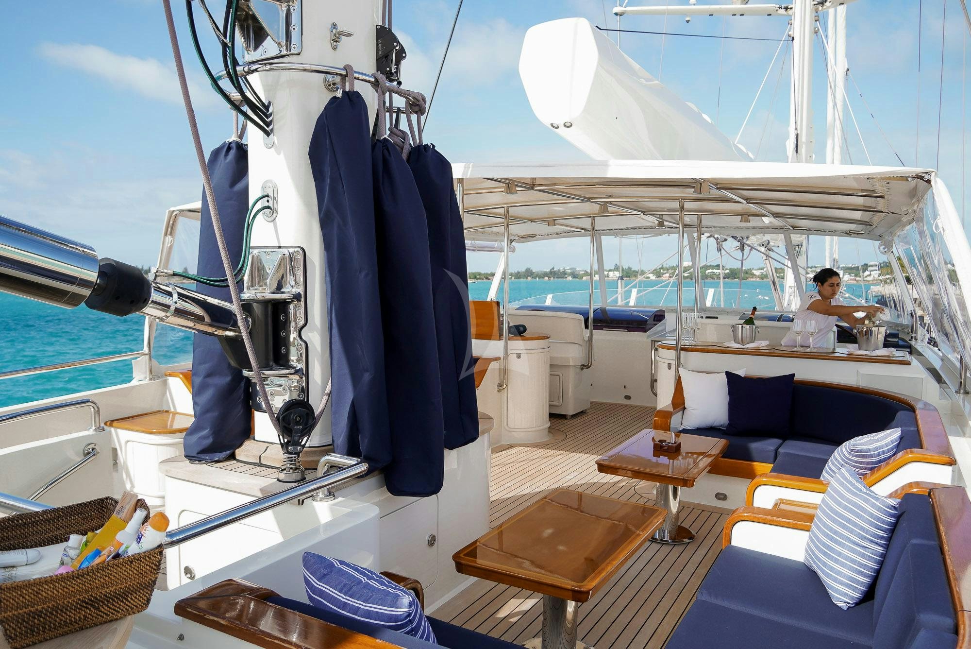 a boat with a person sitting on it aboard ZENJI Yacht for Charter