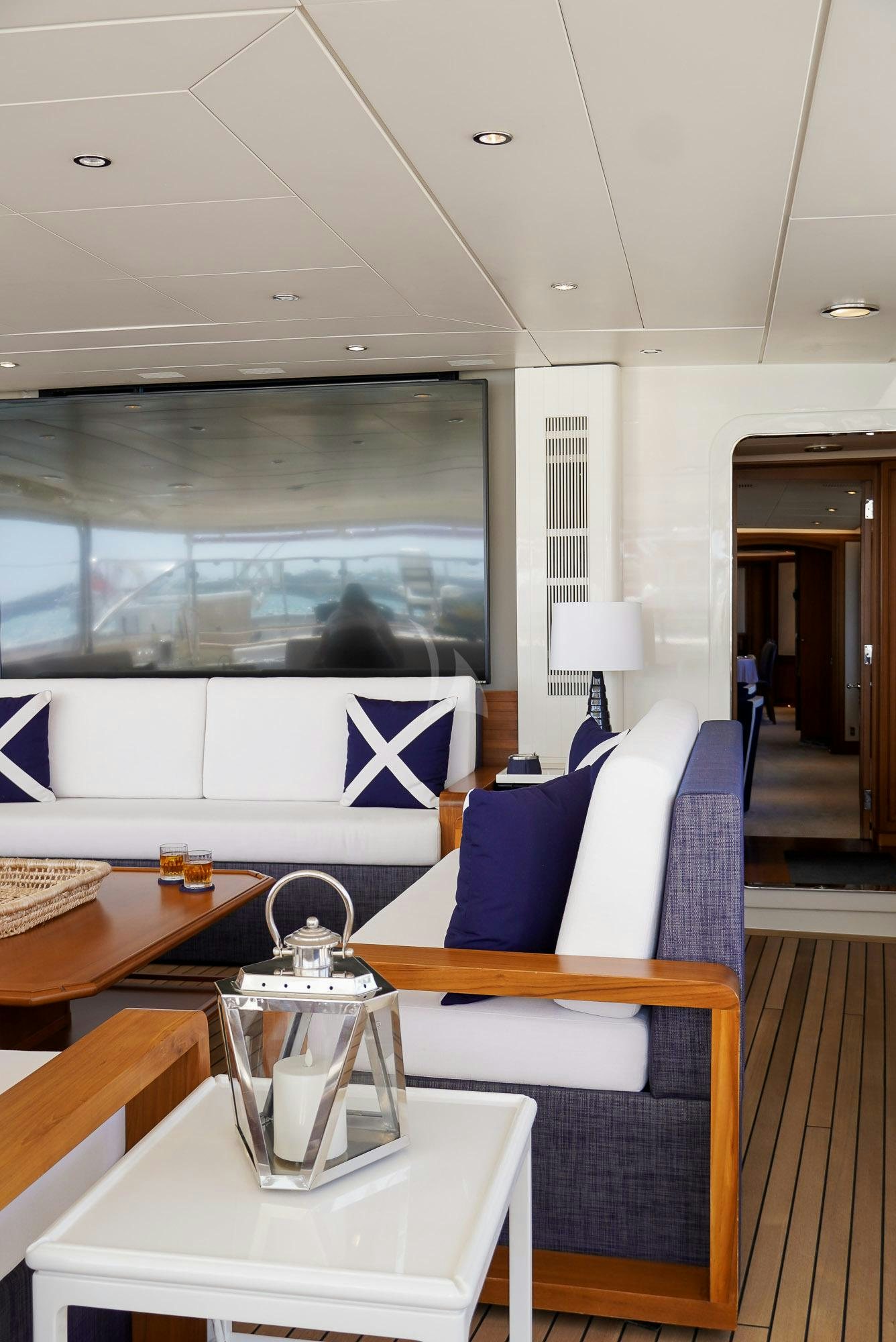 a room with a table and chairs aboard ZENJI Yacht for Charter
