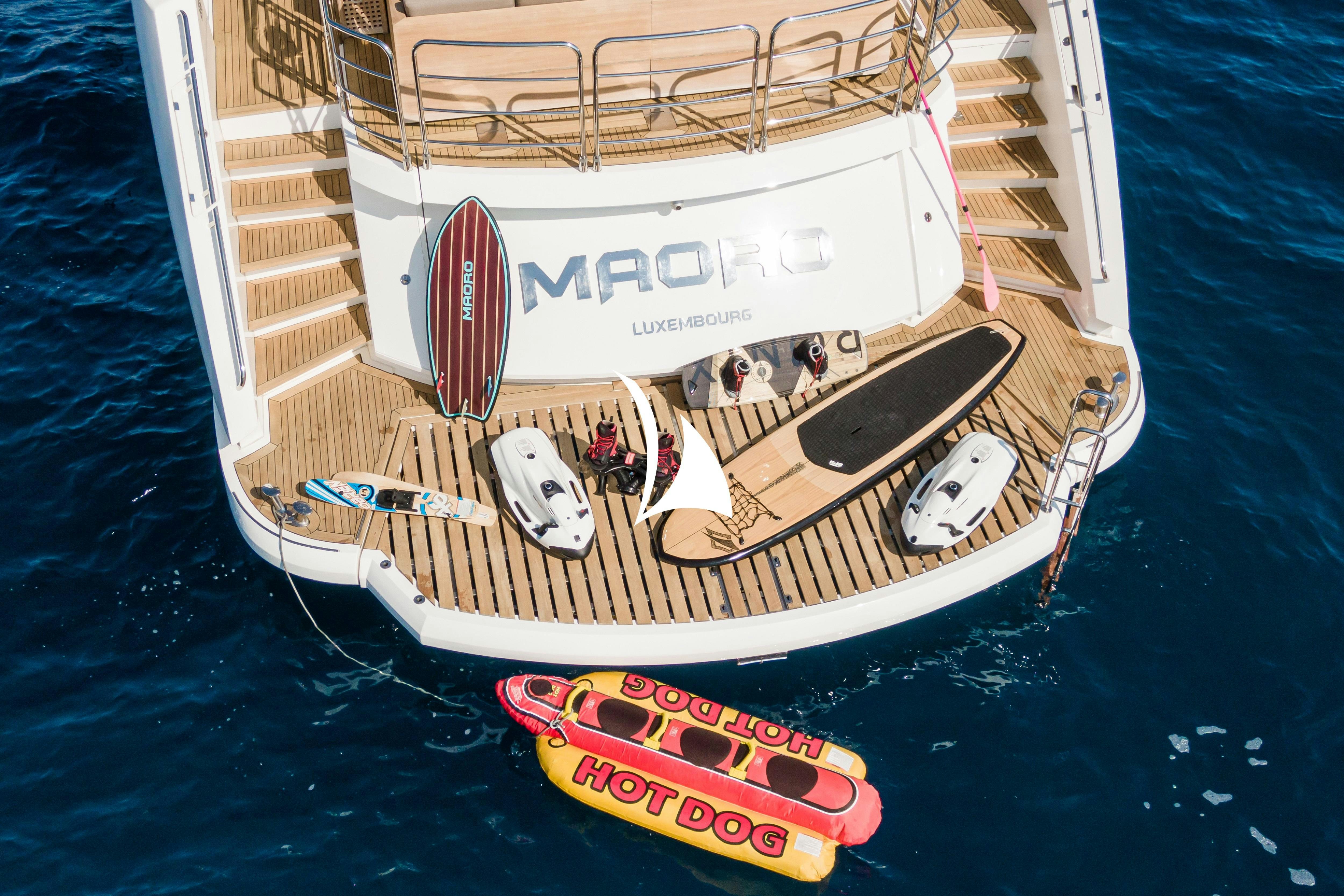 a boat with a red and white stripe on the front aboard MAORO Yacht for Charter