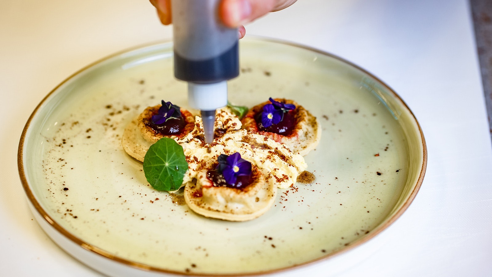a person holding a bottle of nail polish aboard NEXT CHAPTER Yacht for Charter