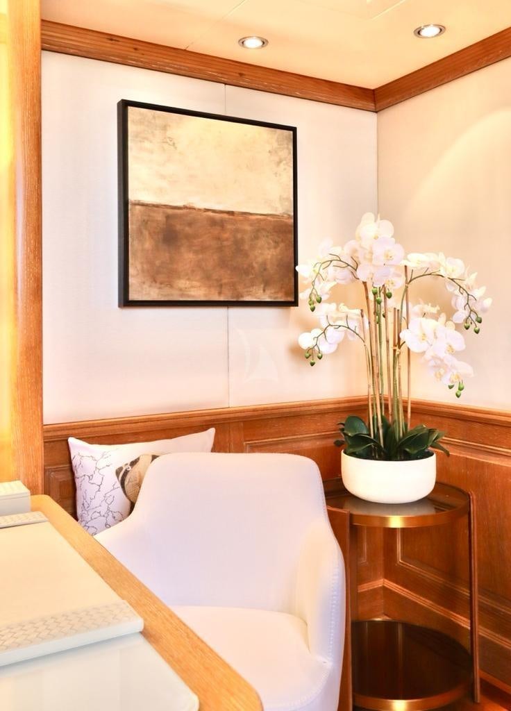 a vase of flowers on a table aboard SOLAFIDE Yacht for Charter