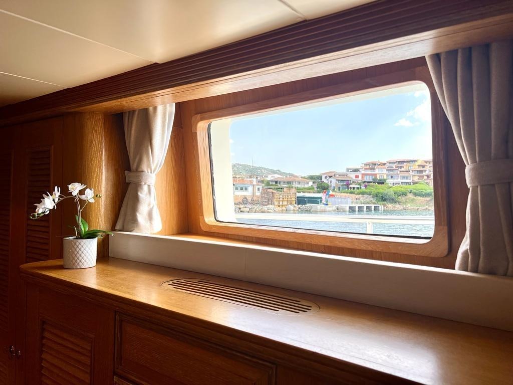 a window with a view of a city aboard SOLAFIDE Yacht for Charter
