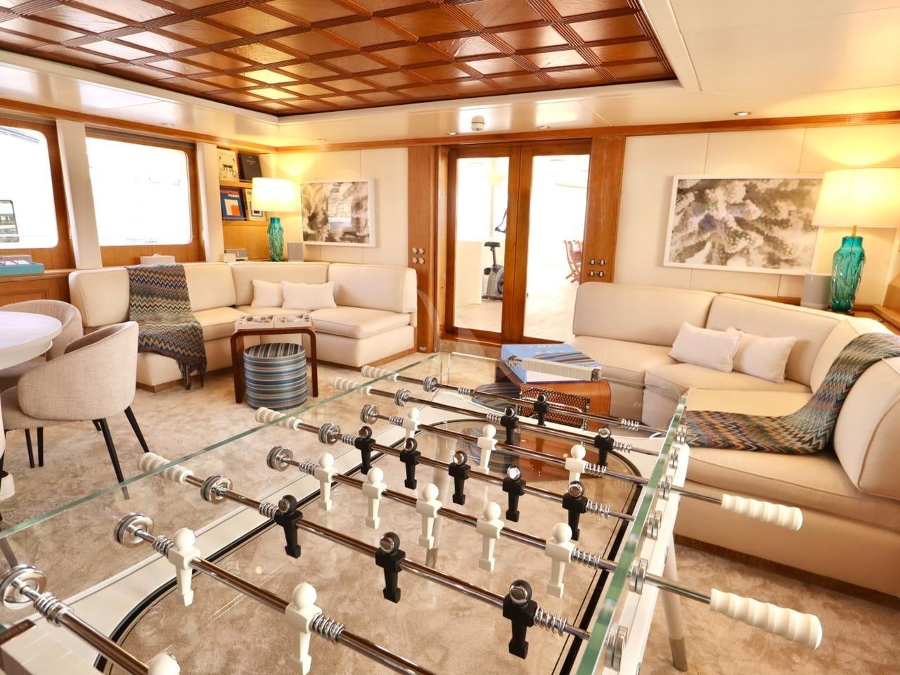 a living room with a dog aboard SOLAFIDE Yacht for Charter