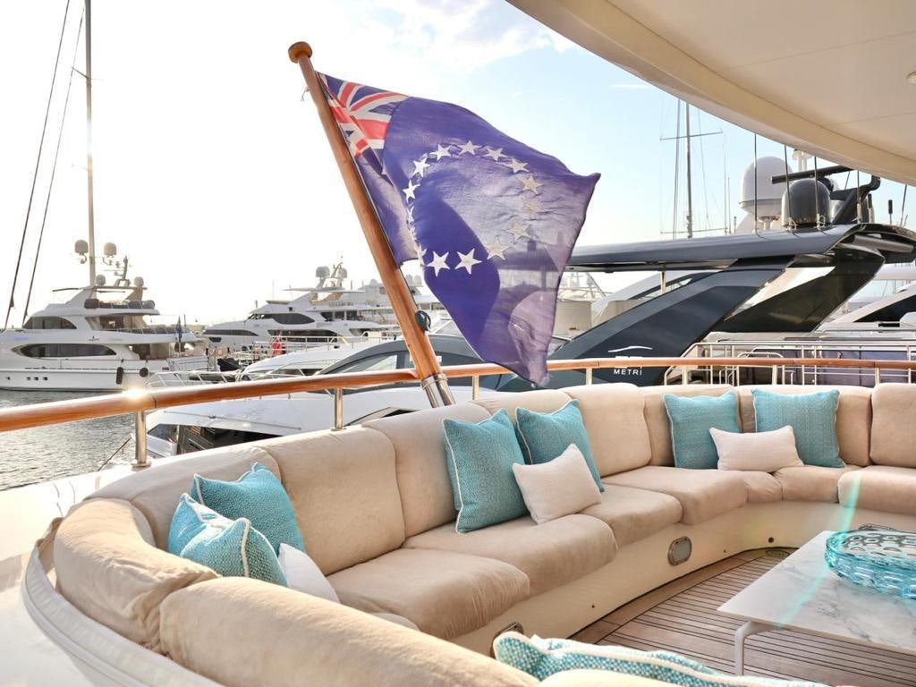 a couch with pillows on it aboard SOLAFIDE Yacht for Charter
