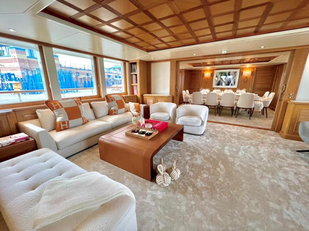 a living room with a large window aboard SOLAFIDE Yacht for Charter