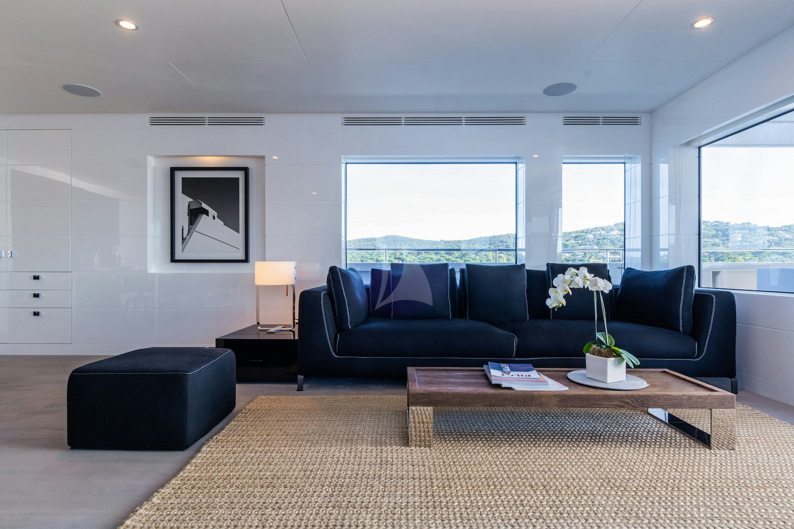 a living room with a couch and a coffee table aboard S7 Yacht for Charter