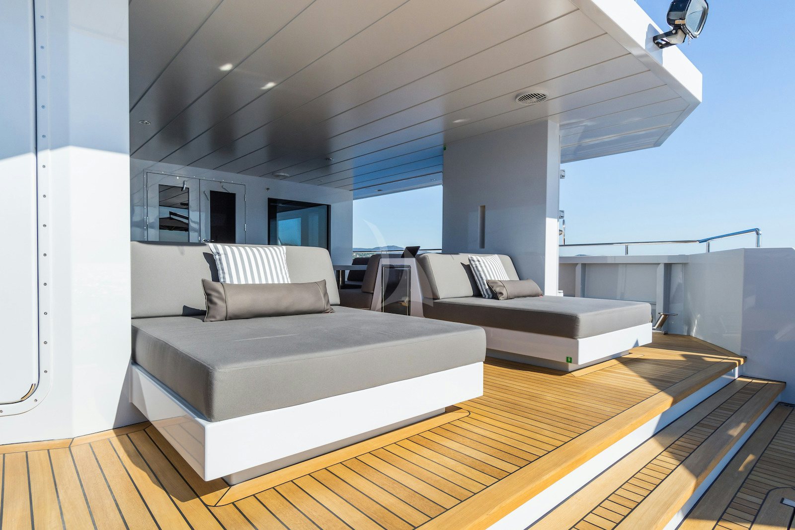 a room with a couch and a table aboard S7 Yacht for Charter