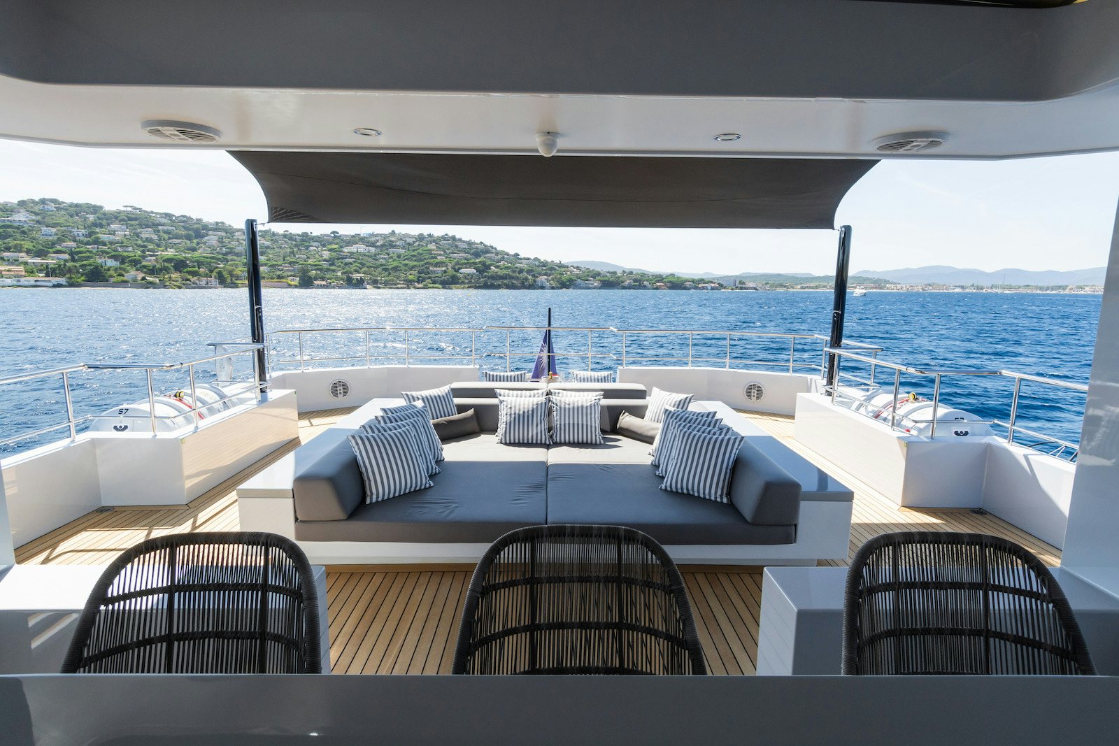 a large white boat on a body of water aboard S7 Yacht for Charter