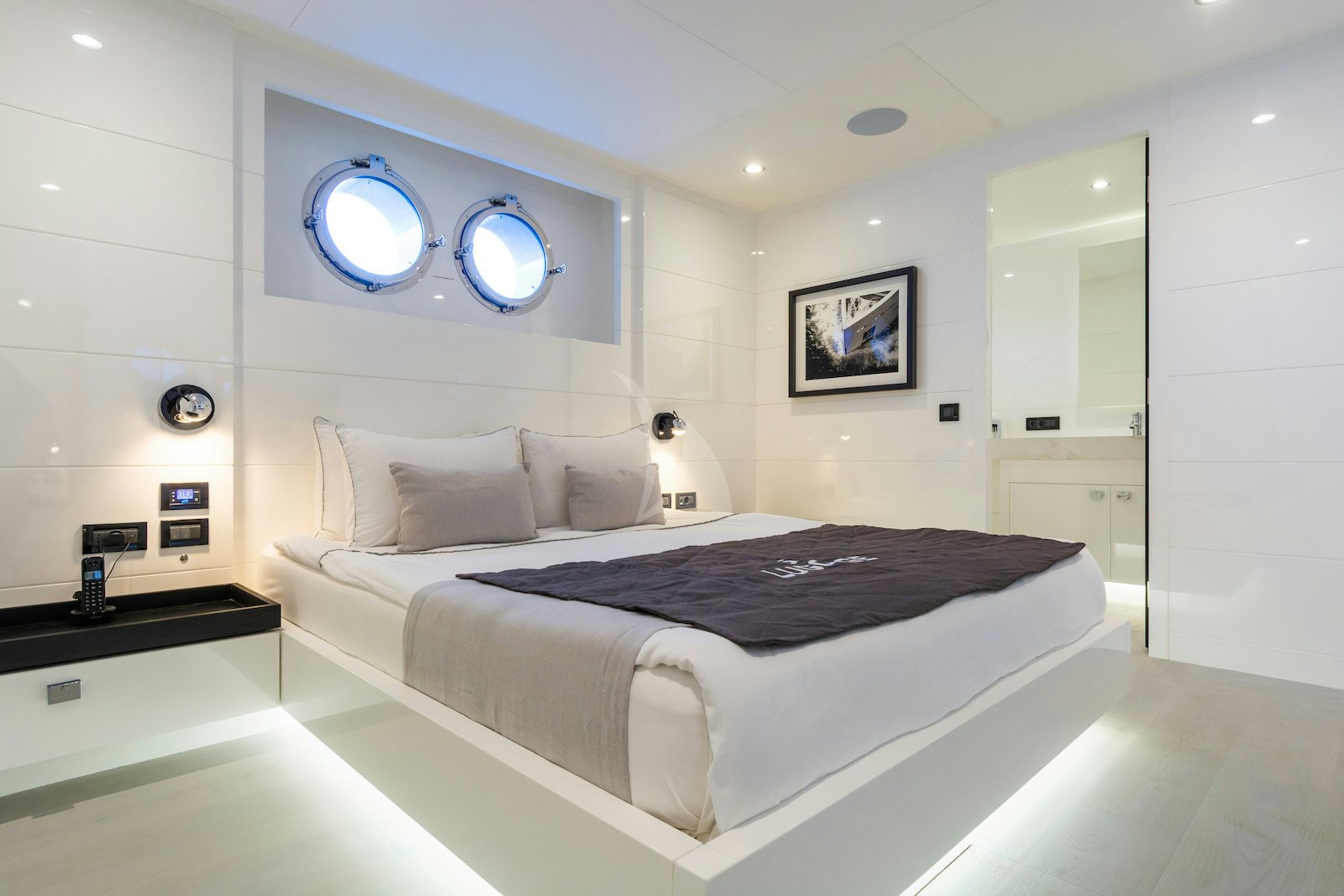 a bed in a room aboard S7 Yacht for Charter