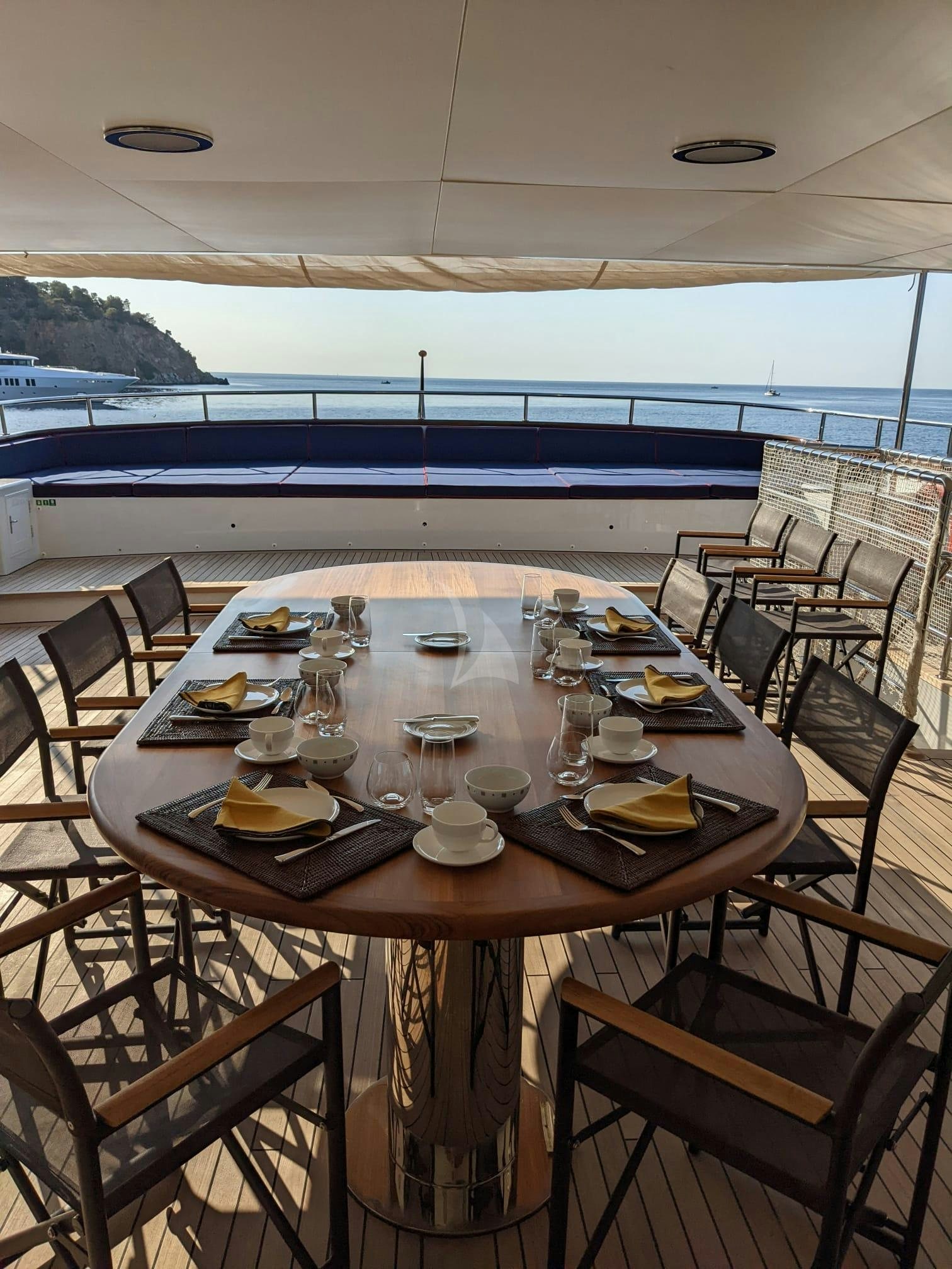 a table set for a meal aboard GENESIA Yacht for Charter