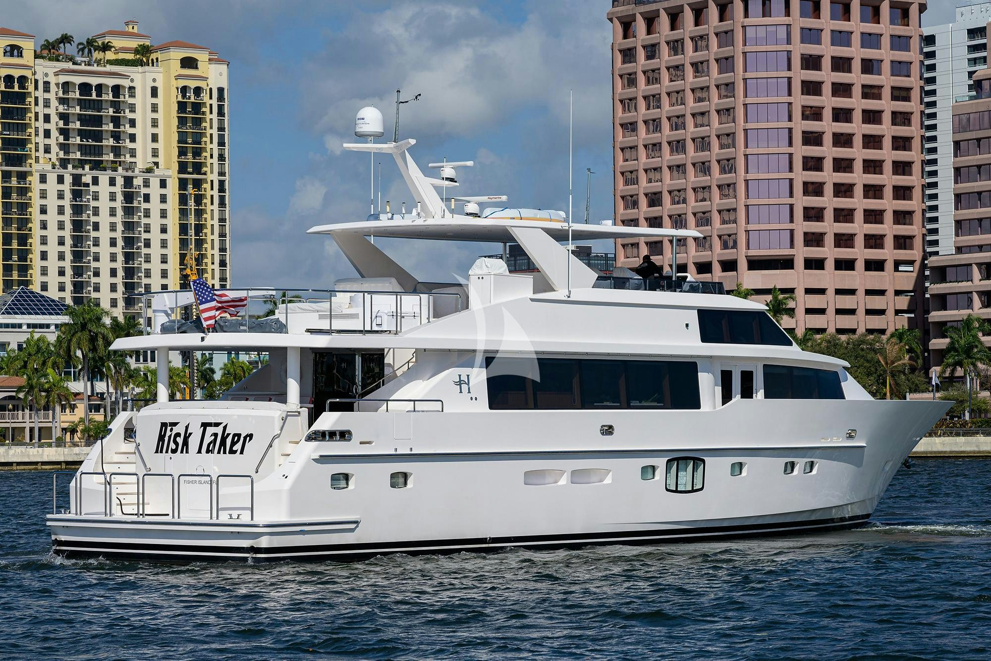a white boat in the water aboard RISK TAKER Yacht for Charter