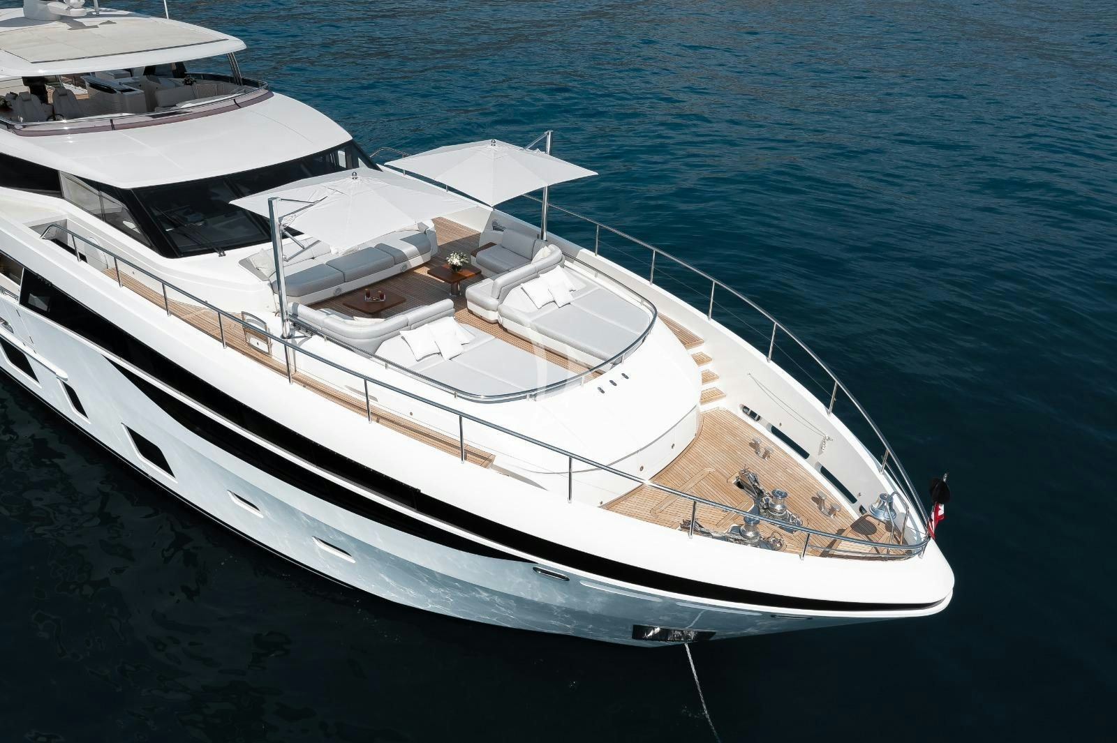 a white boat on the water aboard RIVIERA LIVING Yacht for Charter