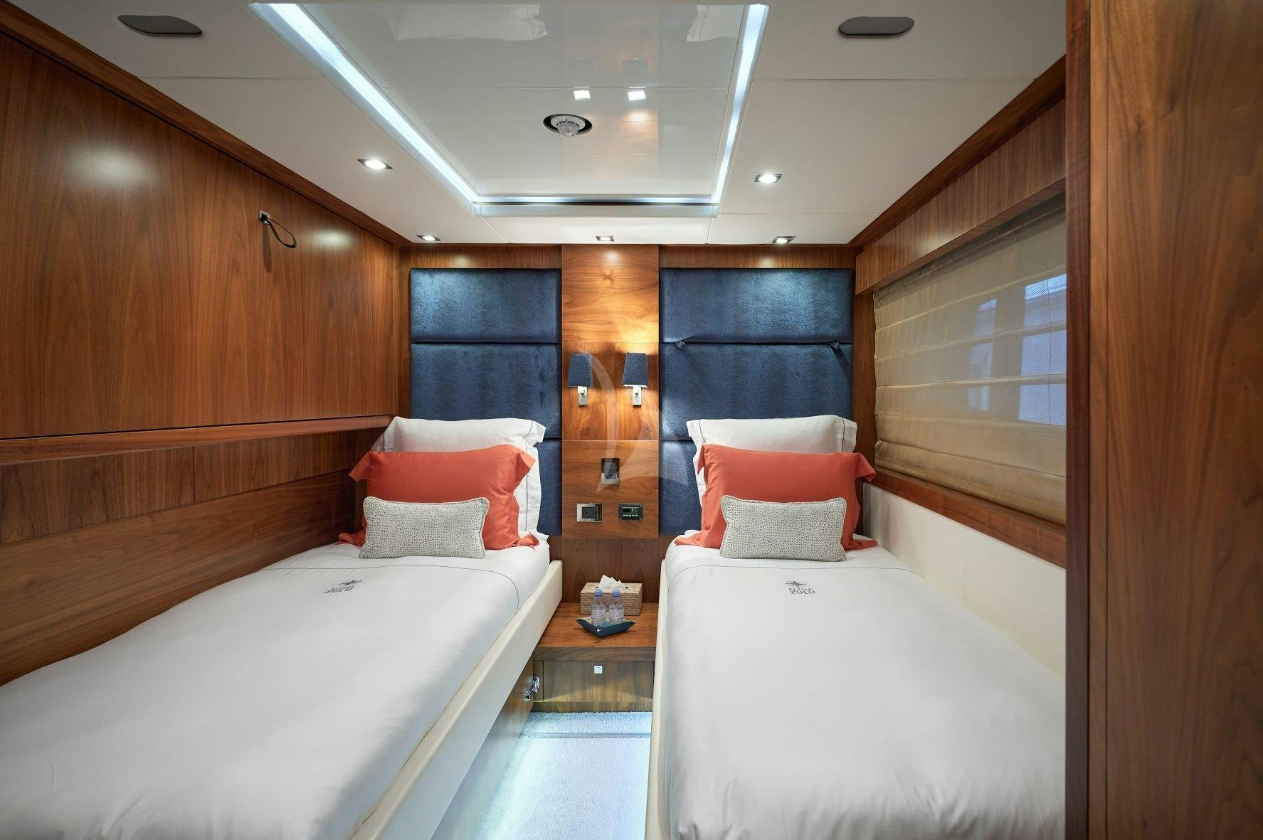 a room with two beds aboard EVEREAST Yacht for Charter