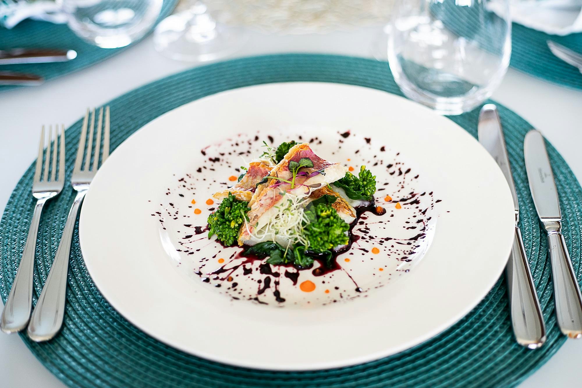 a plate of food aboard EVEREAST Yacht for Charter