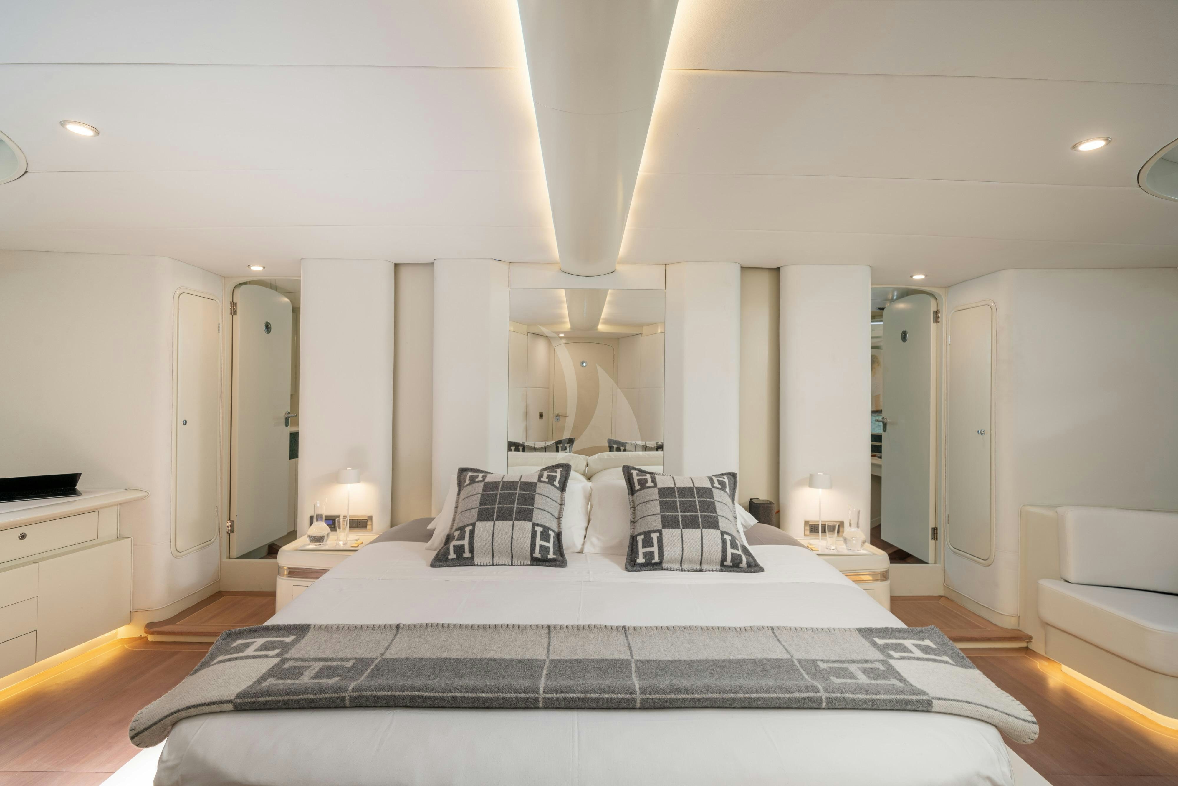 a large bedroom with a large bed aboard ASHLEYROSE110 Yacht for Charter