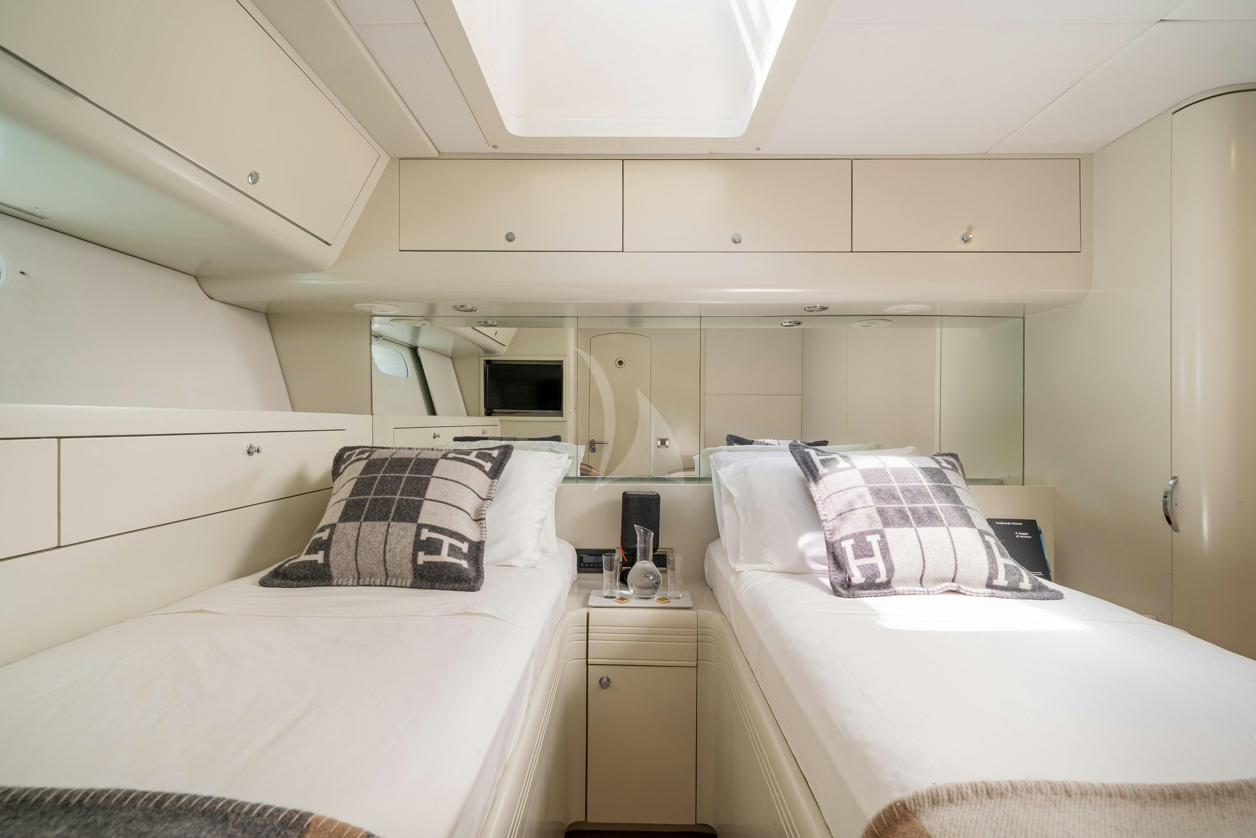a room with two beds aboard ASHLEYROSE110 Yacht for Charter