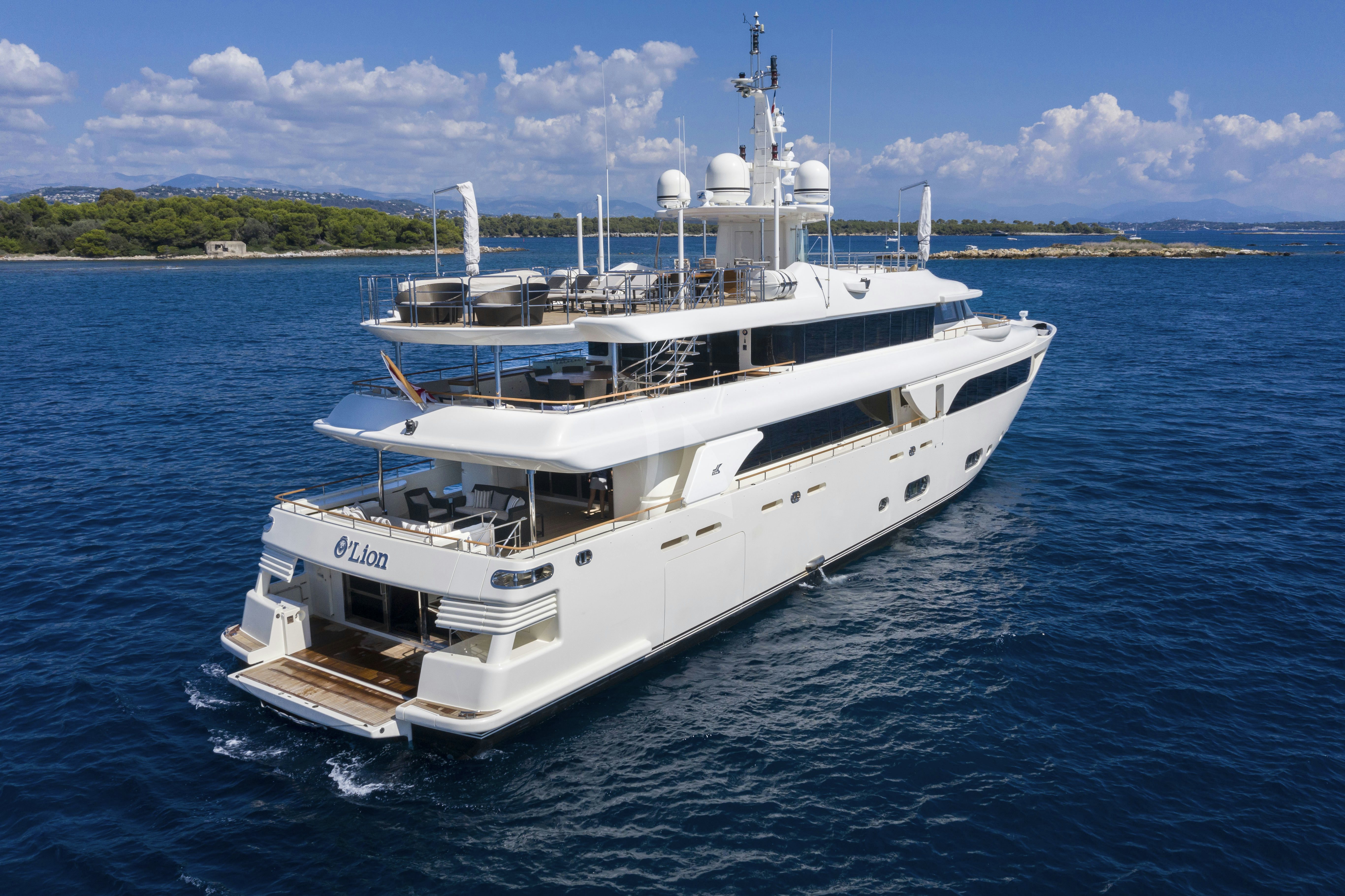 a white boat in the water aboard O'LION Yacht for Charter