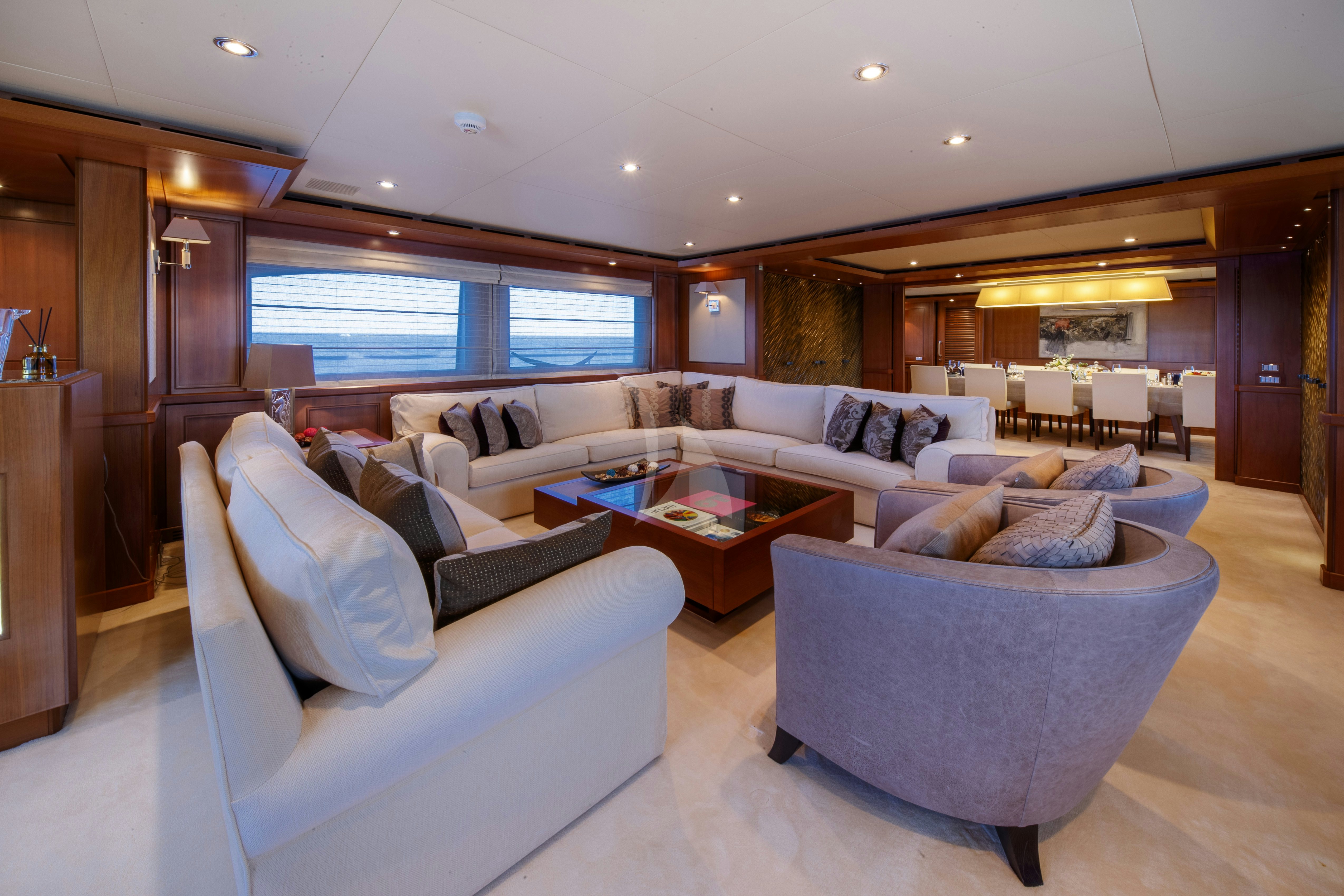 a living room with a large window aboard O'LION Yacht for Charter