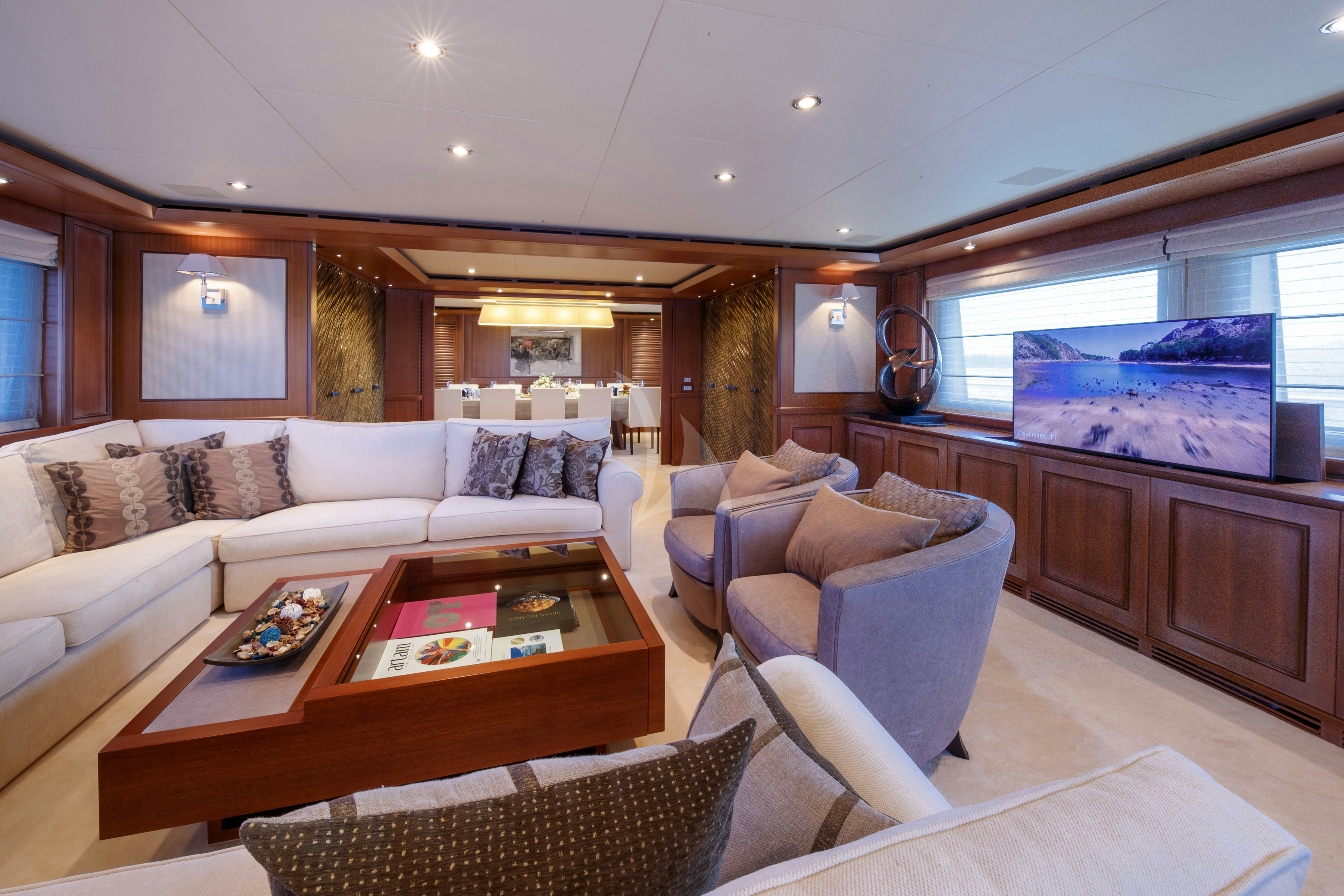 a living room with a large window aboard O'LION Yacht for Charter