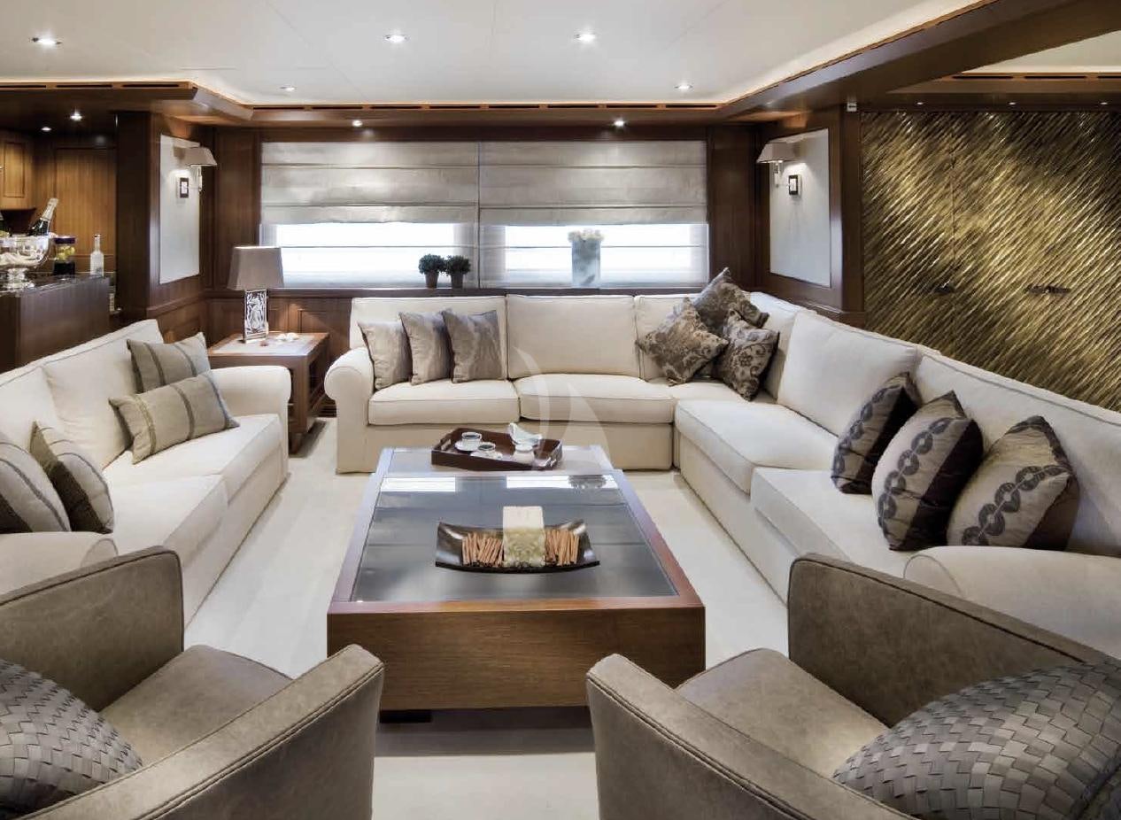 a living room with a couch and a coffee table aboard O'LION Yacht for Charter