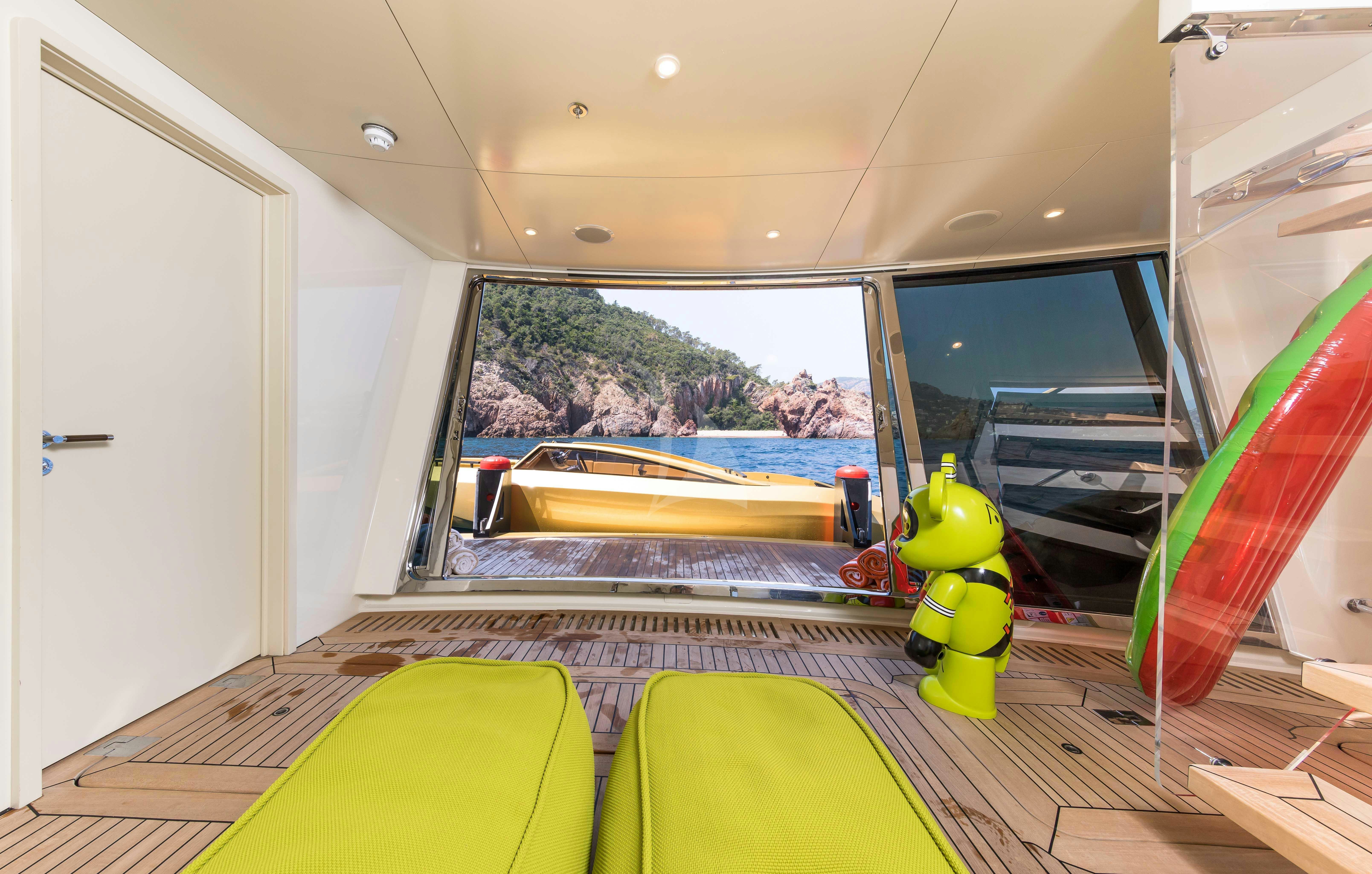 a room with a slide and a yellow toy aboard KHALILAH Yacht for Charter