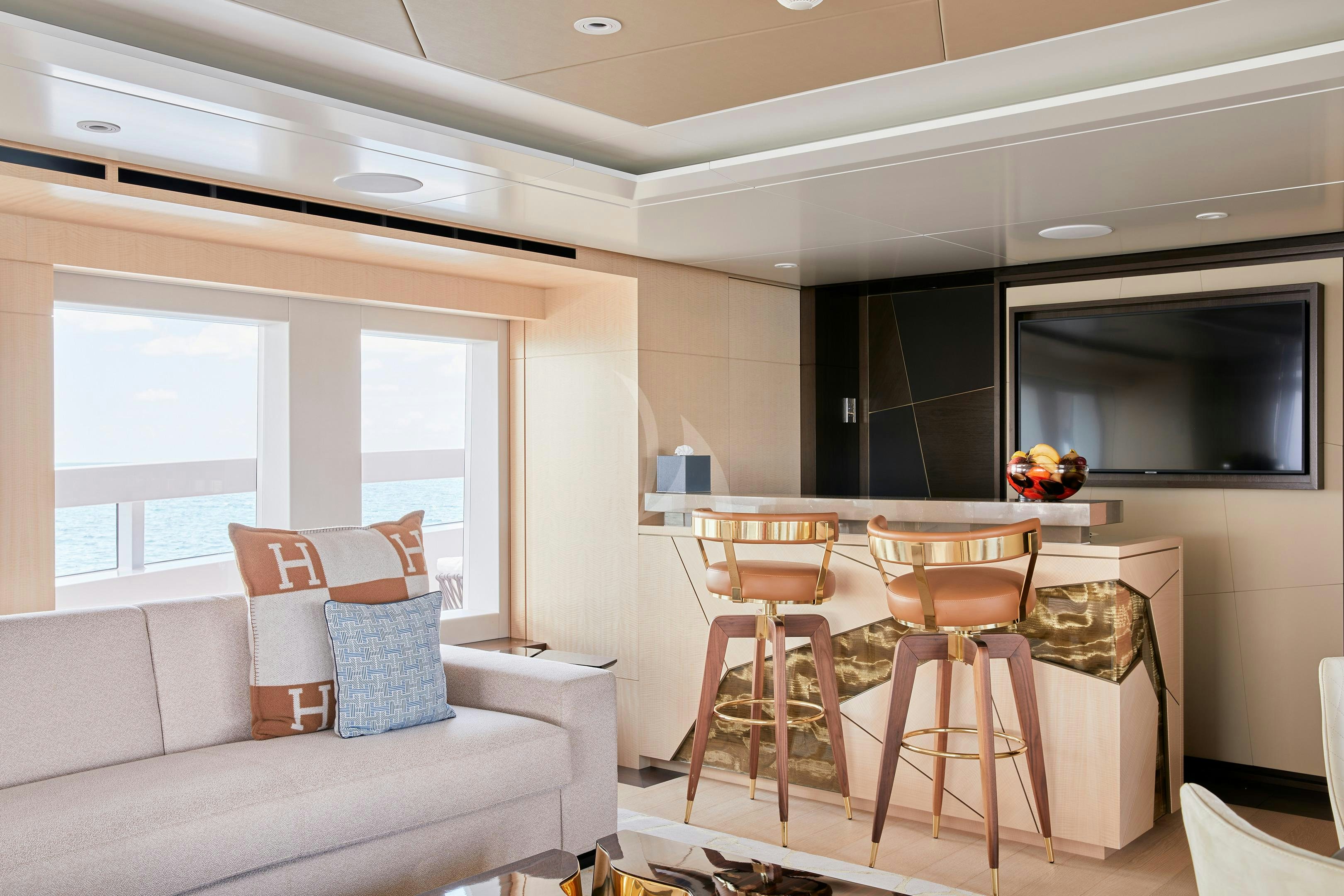 a living room with a couch and a table aboard ARKADIA Yacht for Charter
