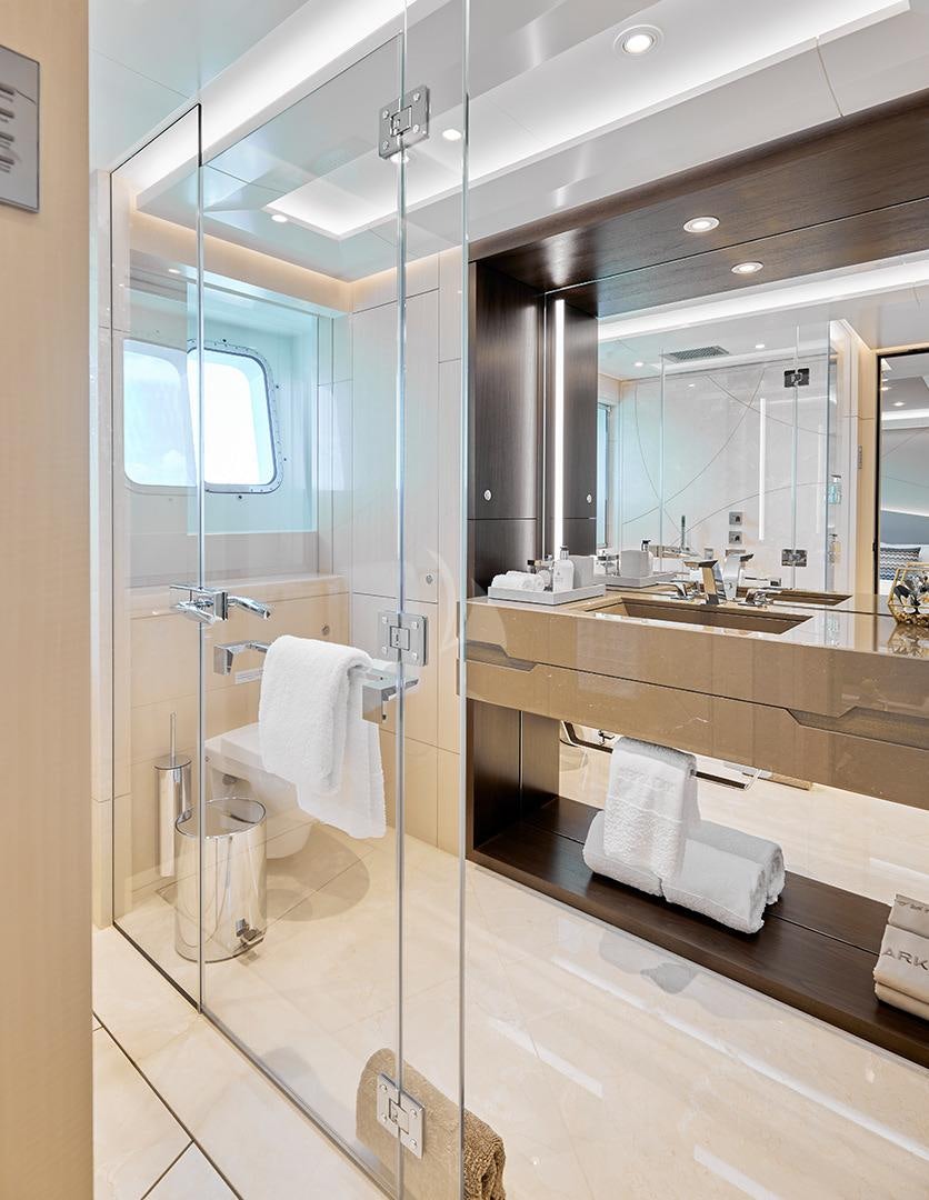 a bathroom with a glass shower aboard ARKADIA Yacht for Charter