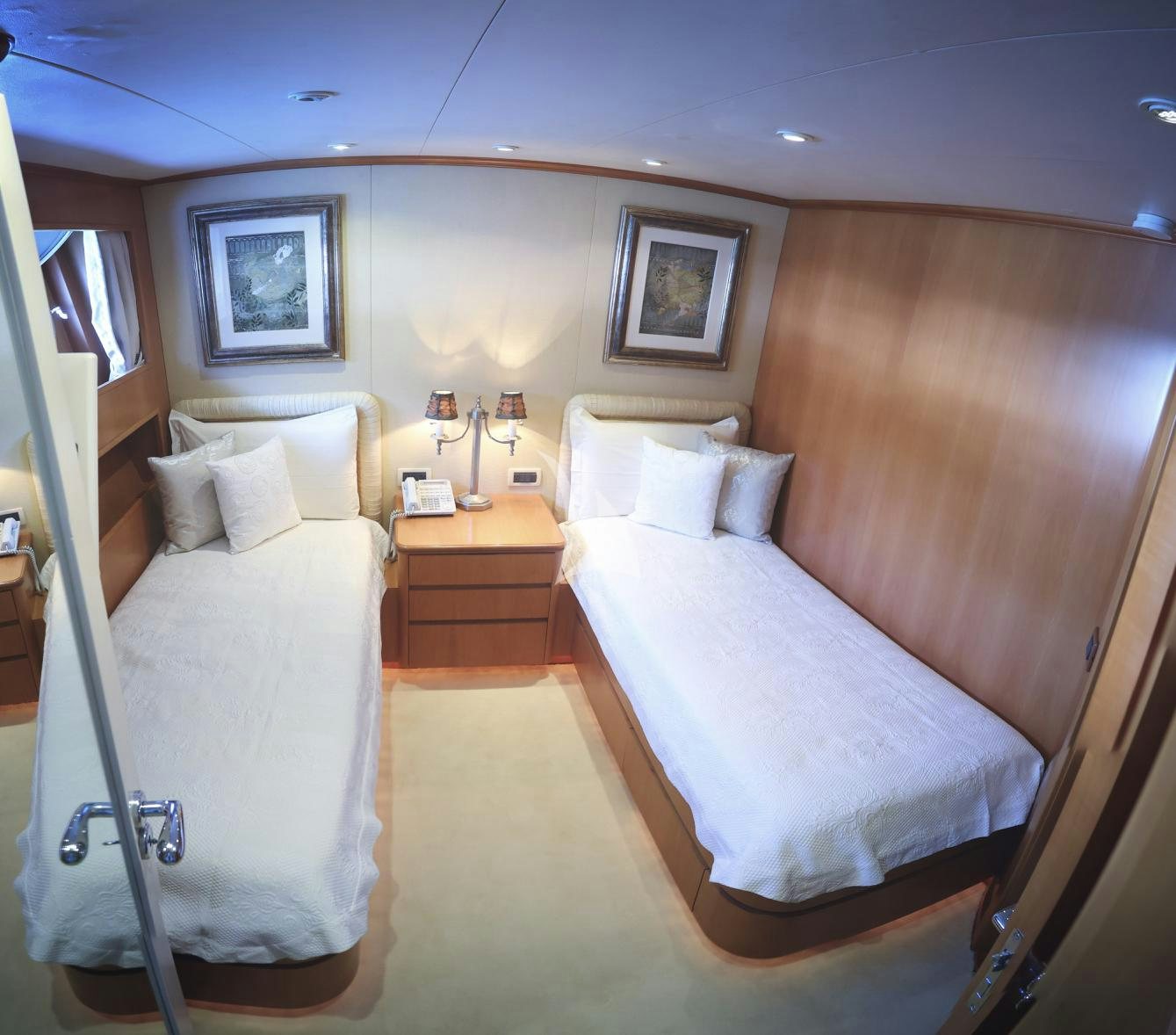 a hotel room with two beds aboard LUNASEA Yacht for Charter
