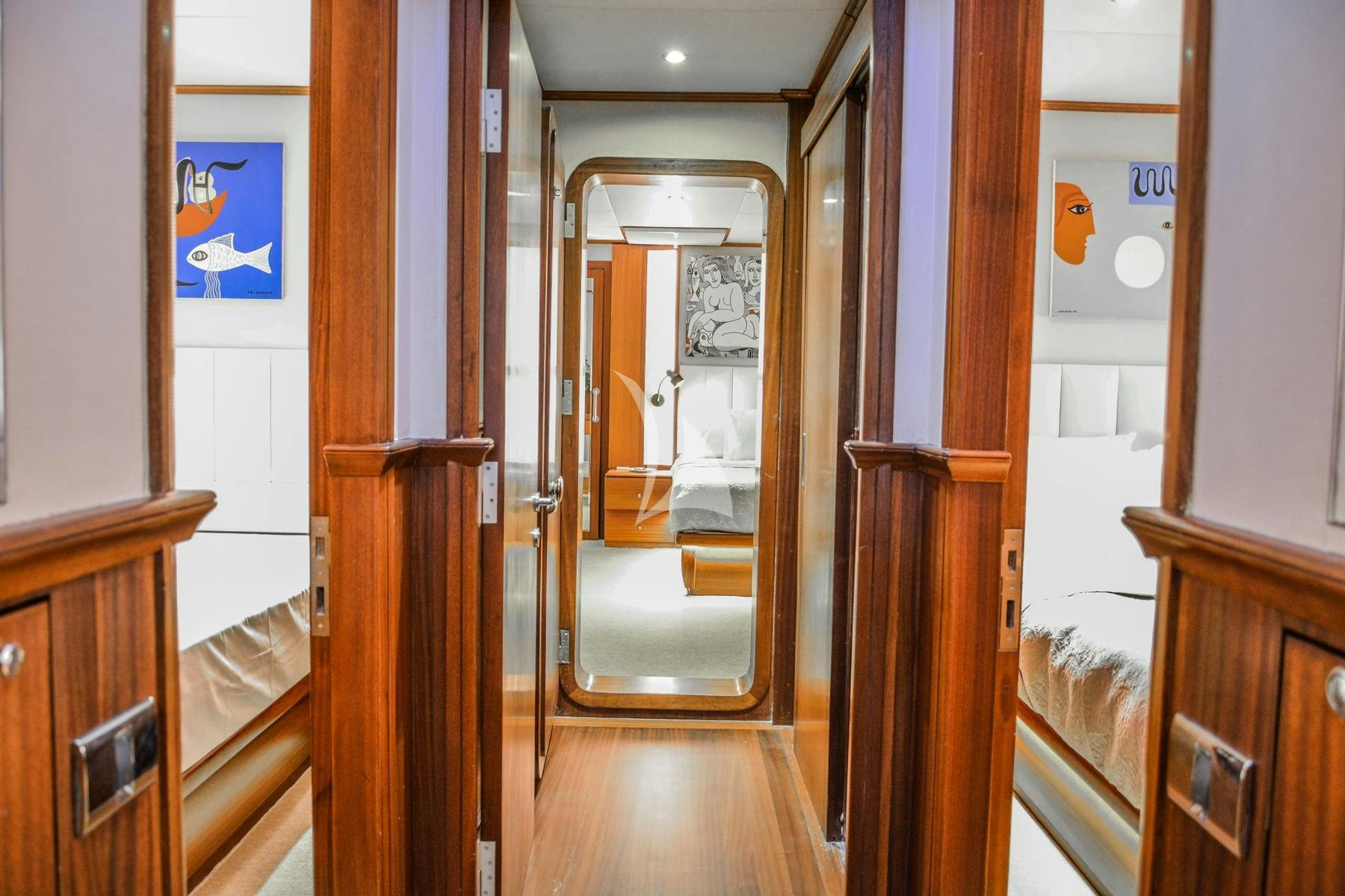 a hallway with a door and a mirror aboard PAPA JOE Yacht for Charter
