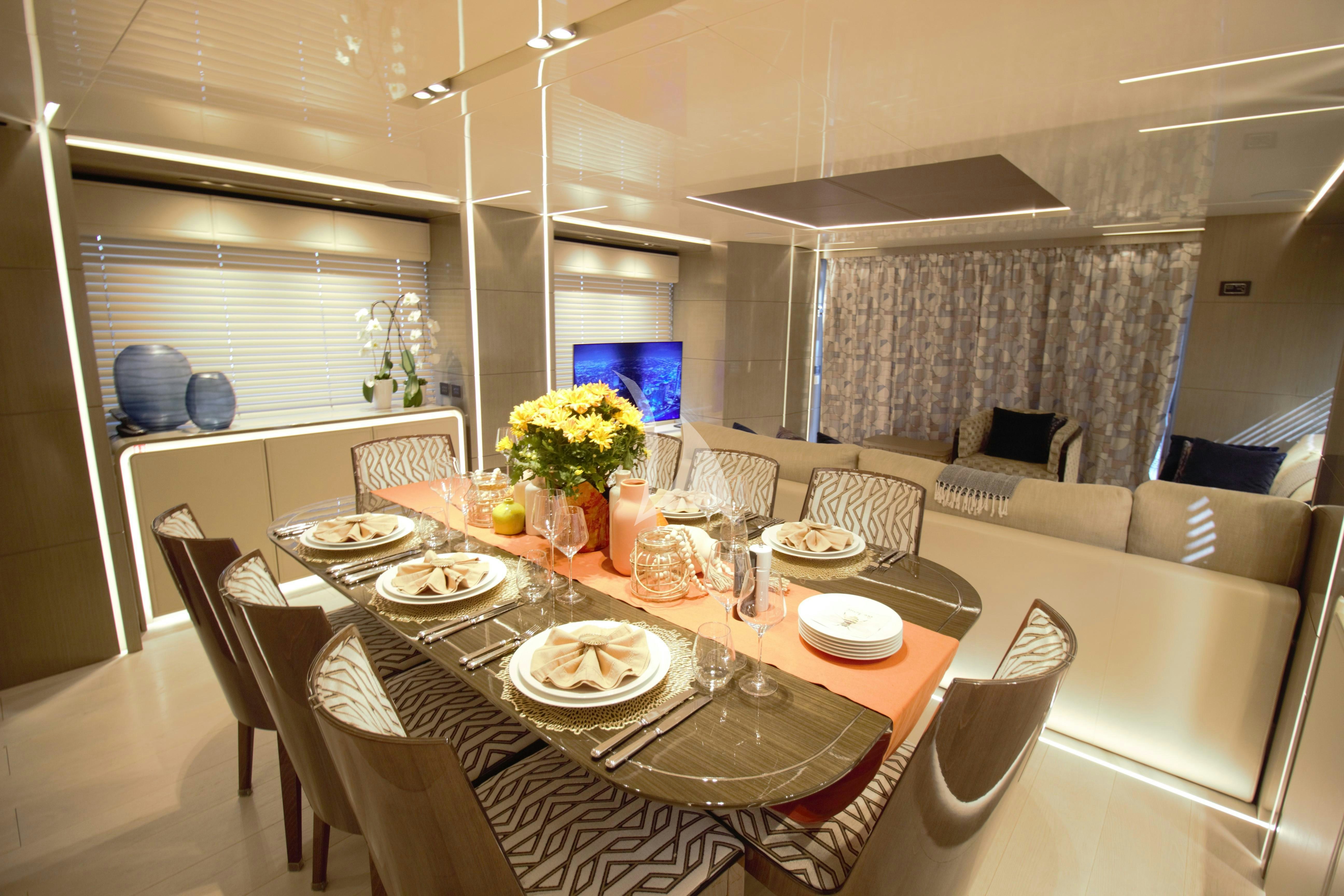 a dining room with a table set aboard THE PEDDLER Yacht for Sale