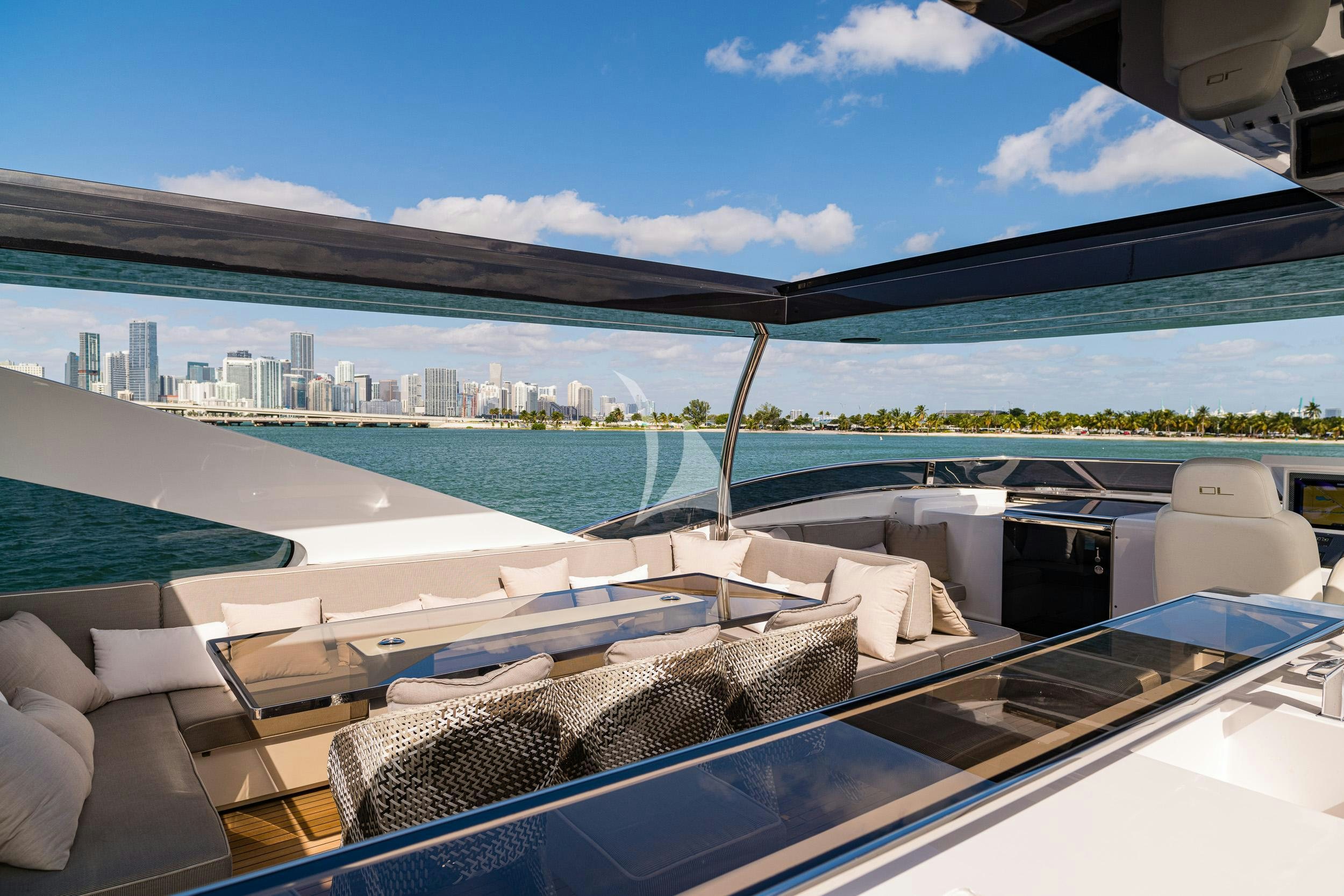a room with a view of a city and a body of water aboard THE PEDDLER Yacht for Sale