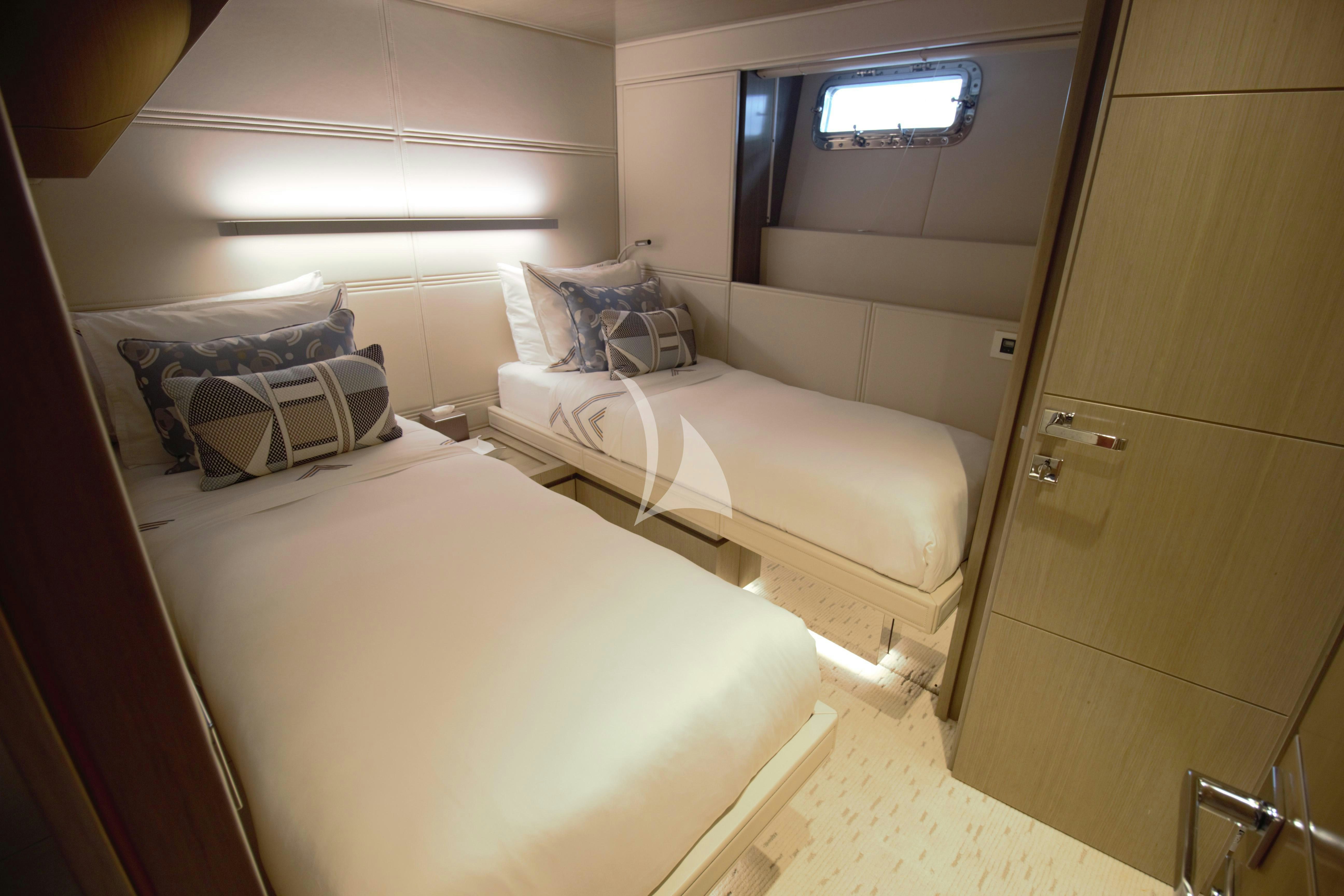 a room with two beds aboard THE PEDDLER Yacht for Sale