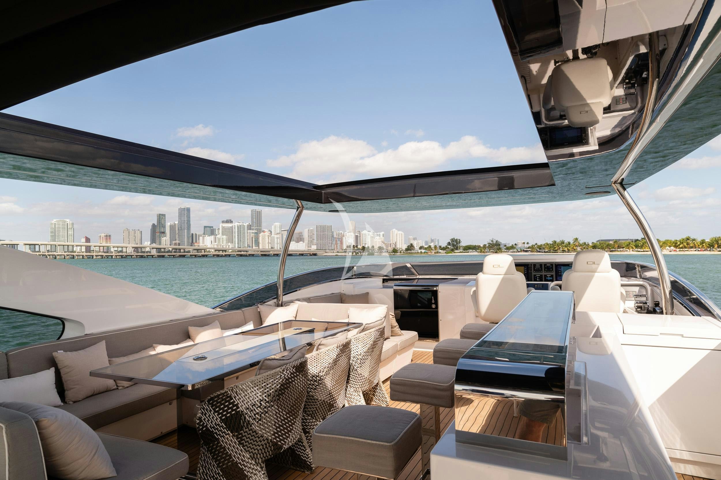 a deck with a view of a city and water aboard THE PEDDLER Yacht for Sale