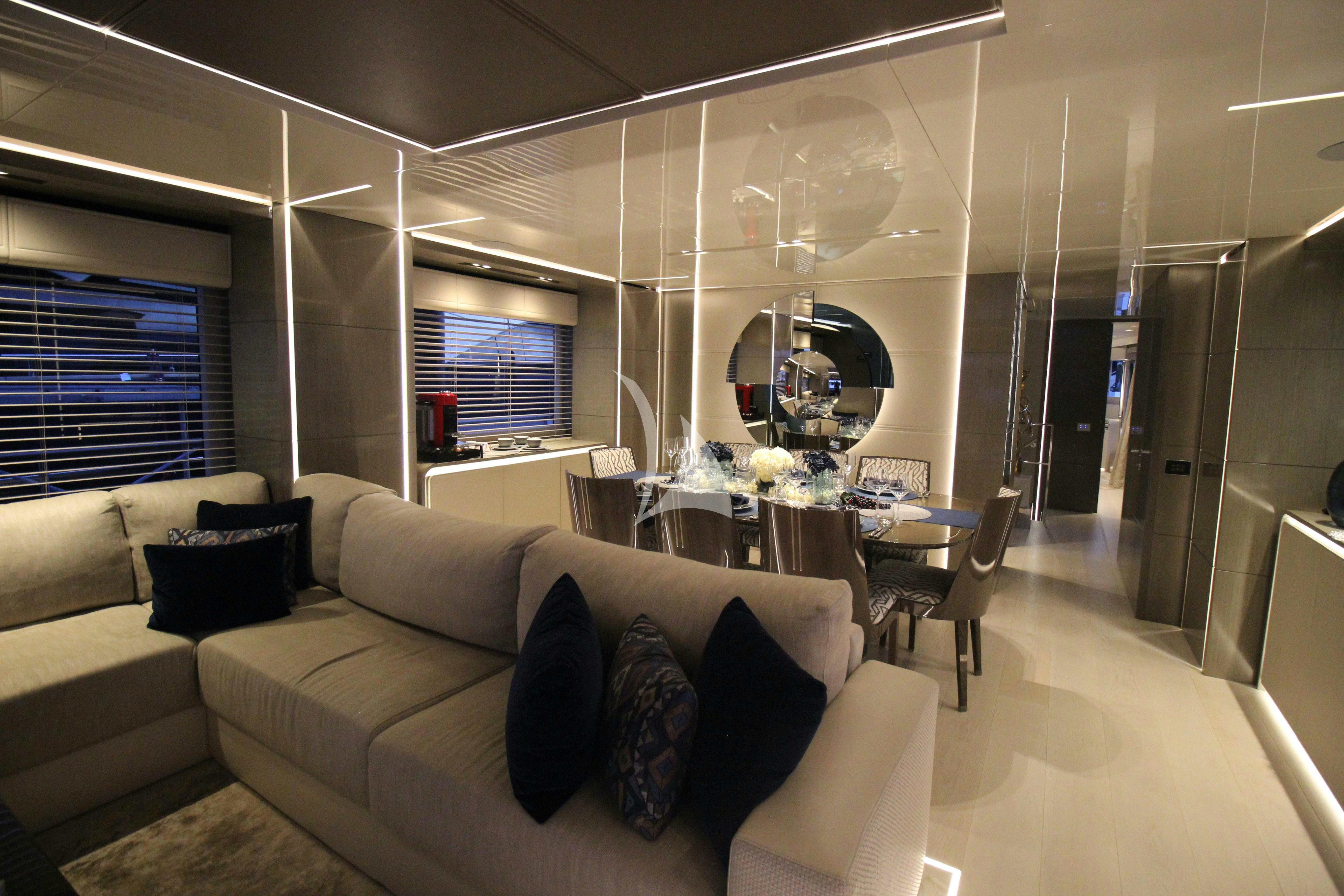 a living room with a couch and a large mirror aboard THE PEDDLER Yacht for Sale