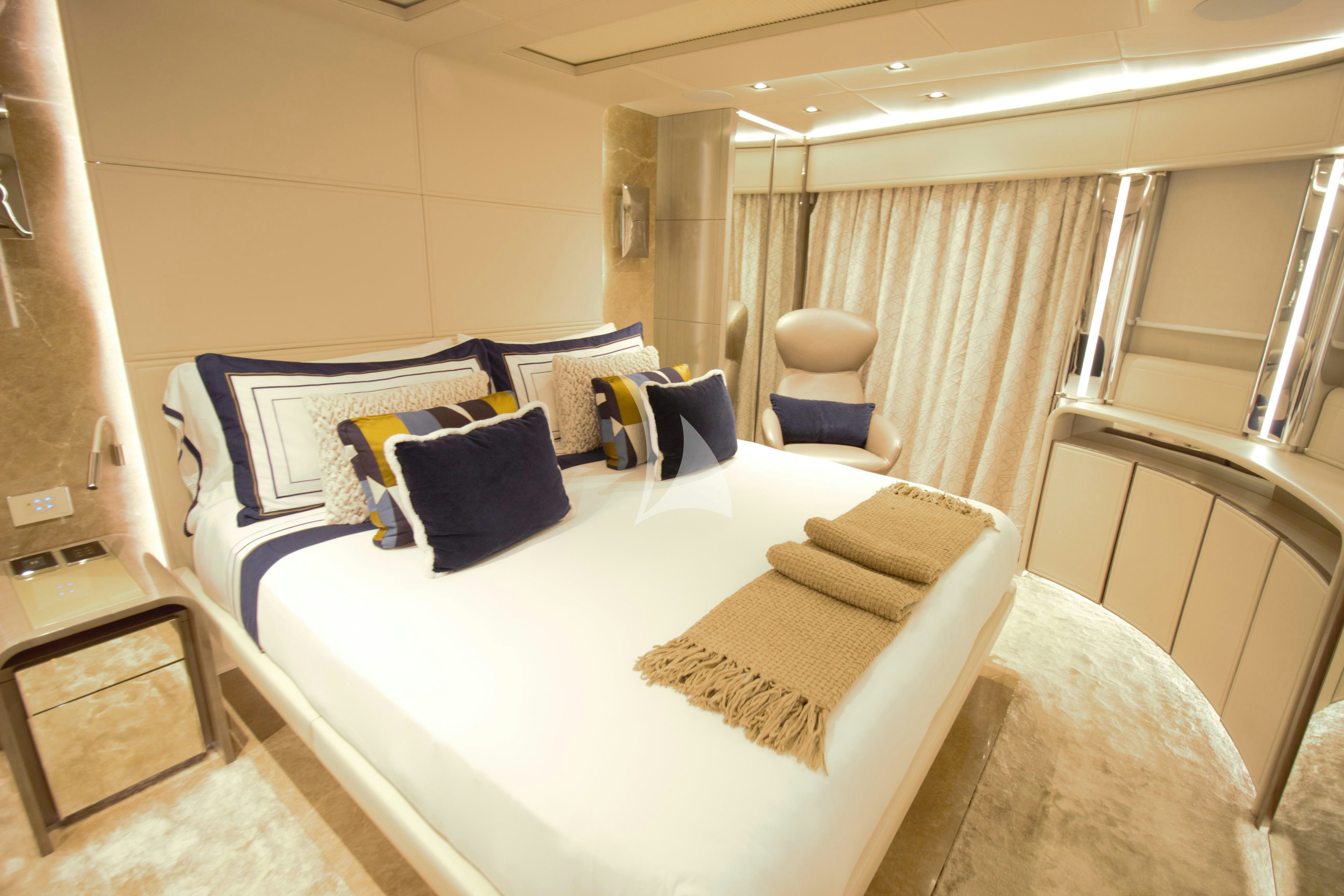 a bed with white sheets and pillows aboard THE PEDDLER Yacht for Sale