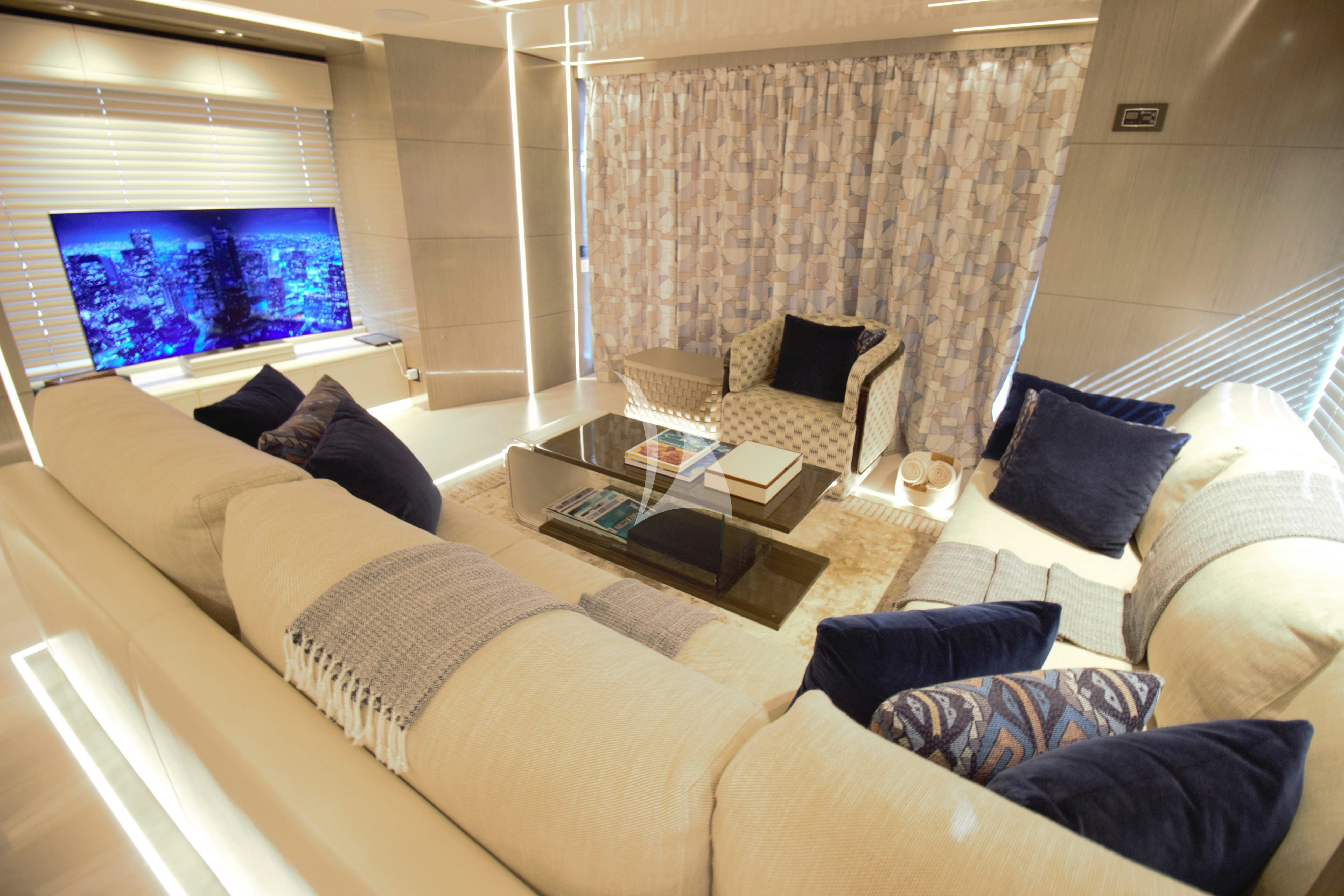 a living room with a couch and a tv aboard THE PEDDLER Yacht for Sale